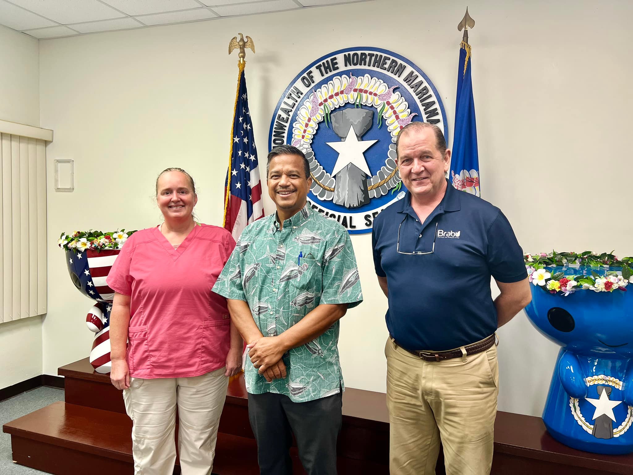 Acting Gov. Jude U. Hofschneider, center, poses for a photo with Dr. Tiffany Lynn Willis, left, and Theodore R. Parker who were re-appointed to the Health Care Professions Licensing Board.  The Senate has confirmed their nominations, and on Wednesday morning, the acting governor administered the oath of office to the two board members.