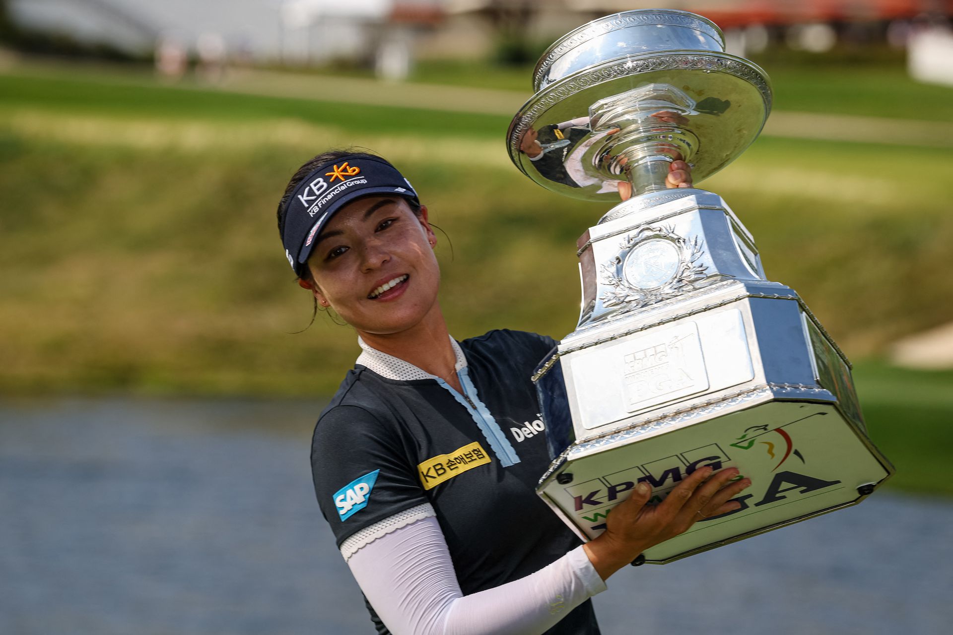 In Gee Chun holds the trophy after winning the KPMG Women's PGA Championship golf tournament at Congressional Country Club in Bethesda, Maryland on June 26, 2022.