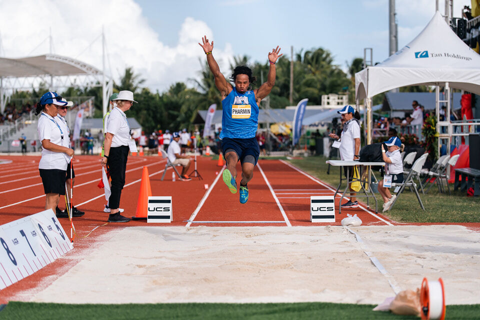 The NMI's Orrin Pharmin attempts a long jump in the athletics event of the 2022 Pacific Mini Games  at the Oleai Track & Field.