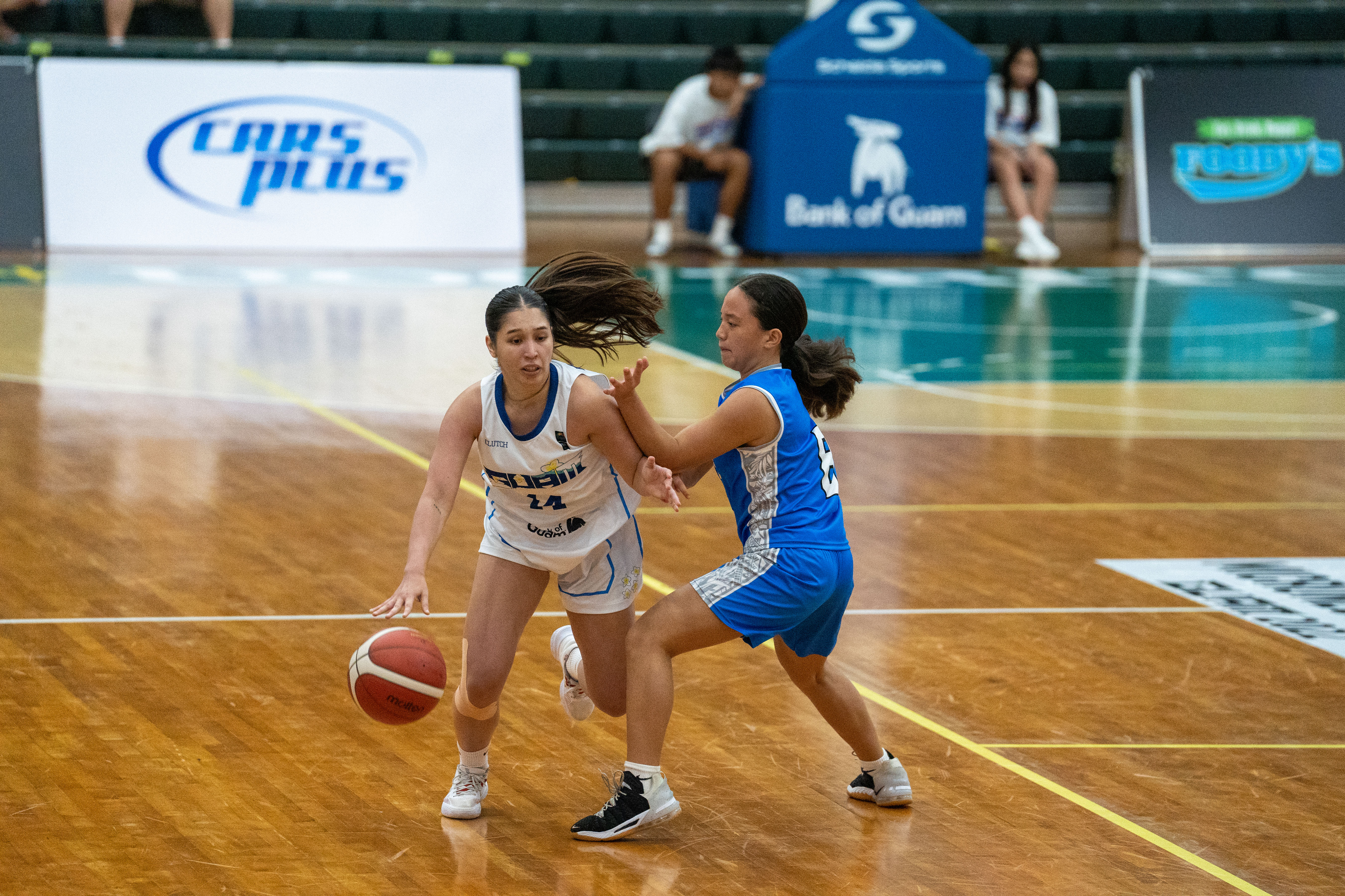 NMI Women's Destiny Pangelinan guards a Guam player.