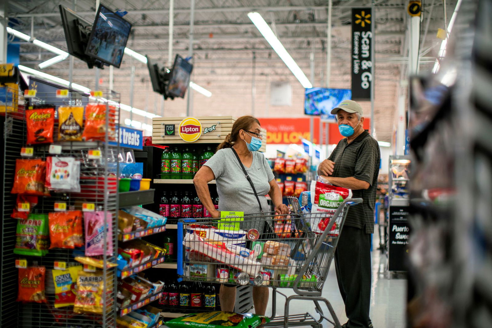 Shoppers are seen wearing masks while shopping at a Walmart store, in North Brunswick, New Jersey on July 20, 2020.