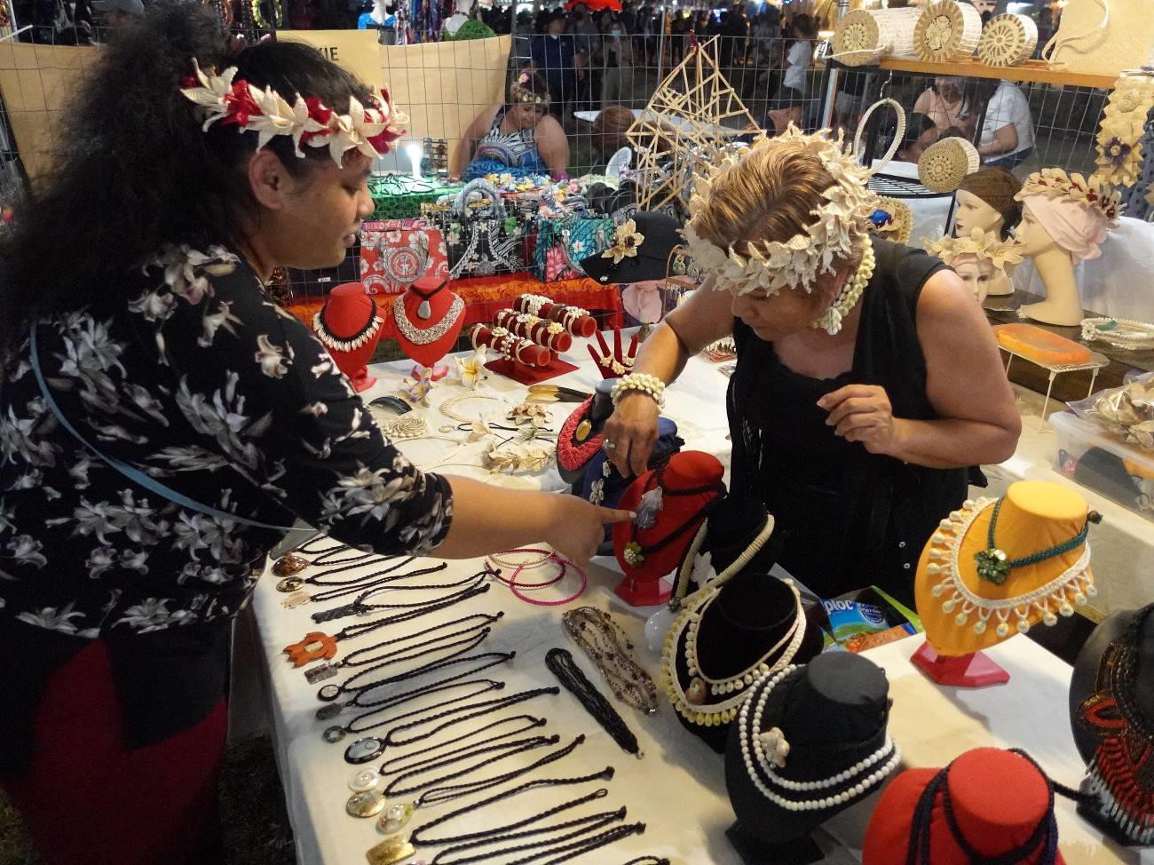 Tokie Mojica, right, sells jewelry and handicrafts at the 23rd Annual Taste of the Marianas International Food Festival & Beer Garden on June 19, 2022 at Garapan Fishing Base. In addition to food, drinks, and live entertainment, the festival features a wide variety of arts and crafts for sale.