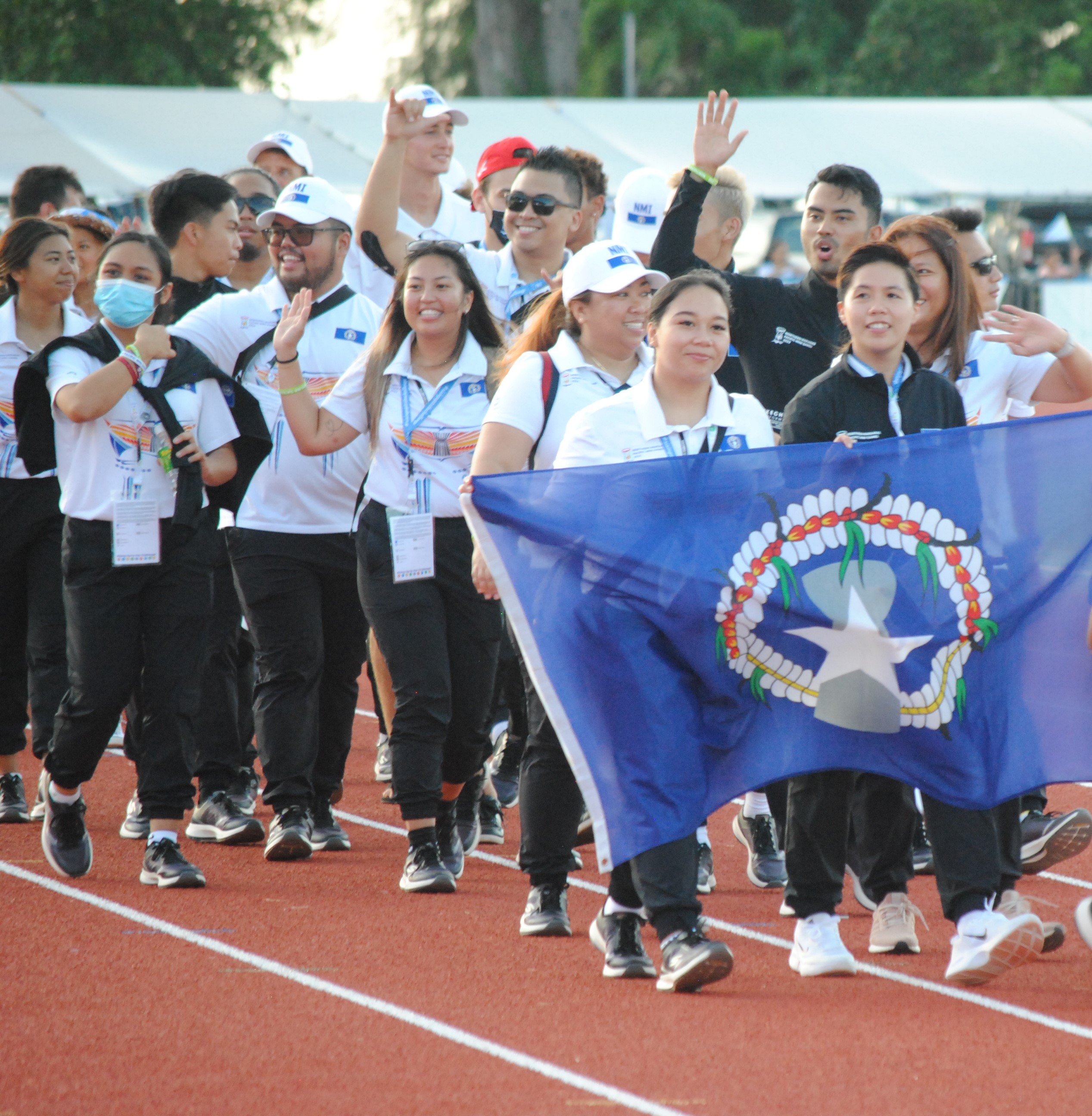 The NMI badminton team members and other local athletes  participate in the closing ceremony of the 2022 Pacific Mini Games at the Oleai Track & Field on Saturday.