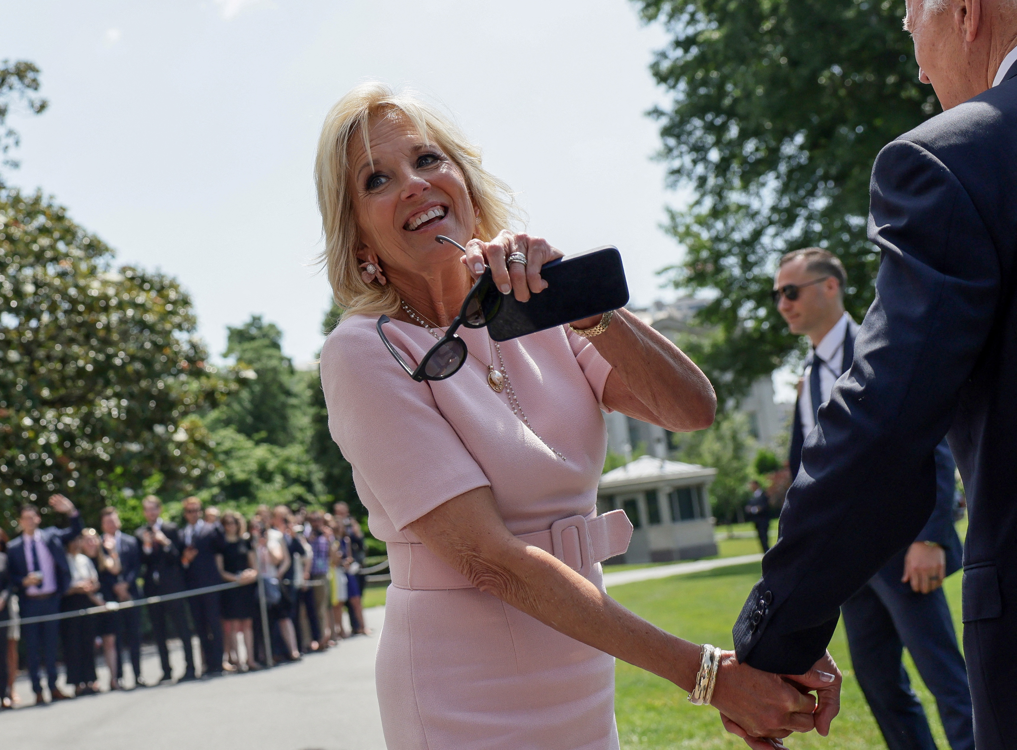 First lady Jill Biden walks with President Joe Biden toward Marine One after he spoke to the media before departing the White House for a weekend in Rehoboth, Delaware, at the White House in Washington, D.C., June 17, 2022.