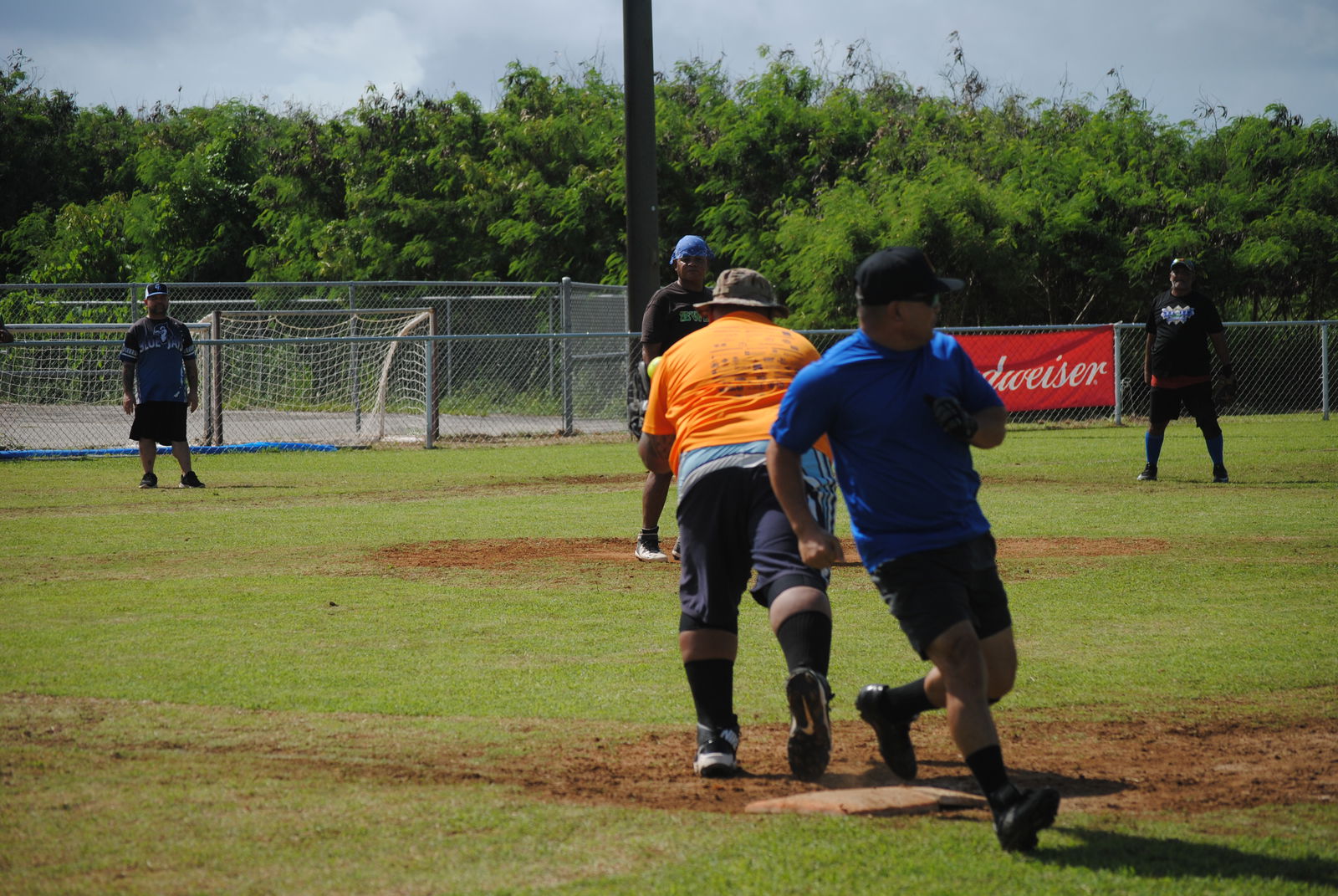 Peleliu's Ben Hocog reaches first base safely during a 2022 Budweiser Belau Amateur Softball League game Sunday at the Dandan baseball field.