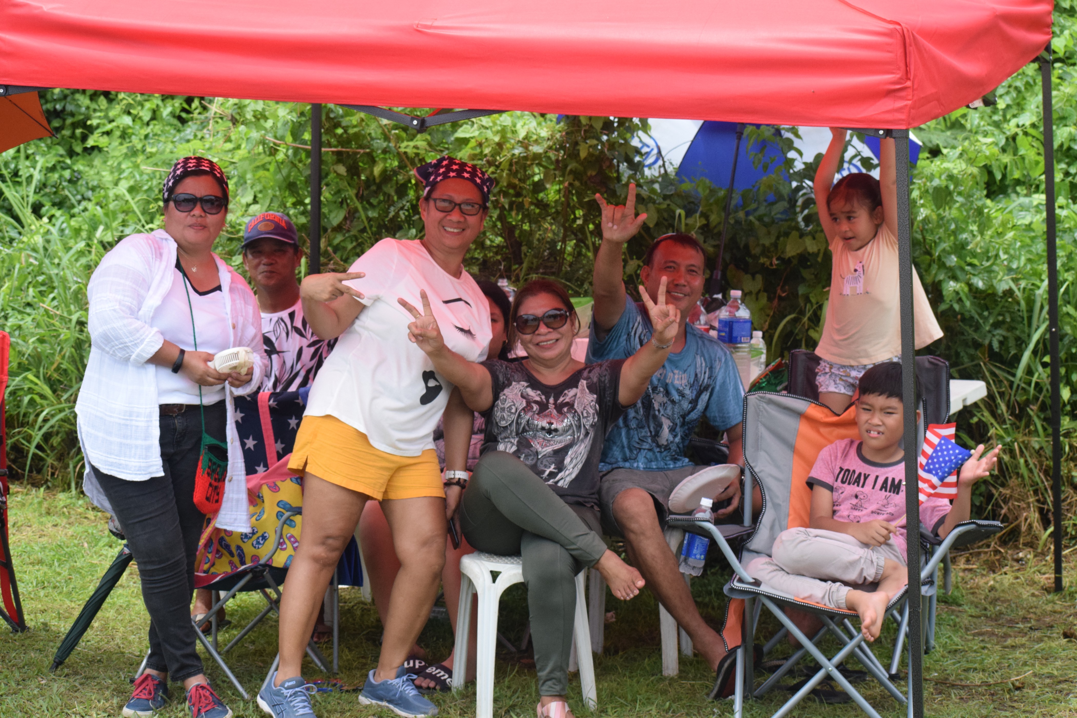 Auto mechanic Ronnie and family enjoy the Liberation Day parade.