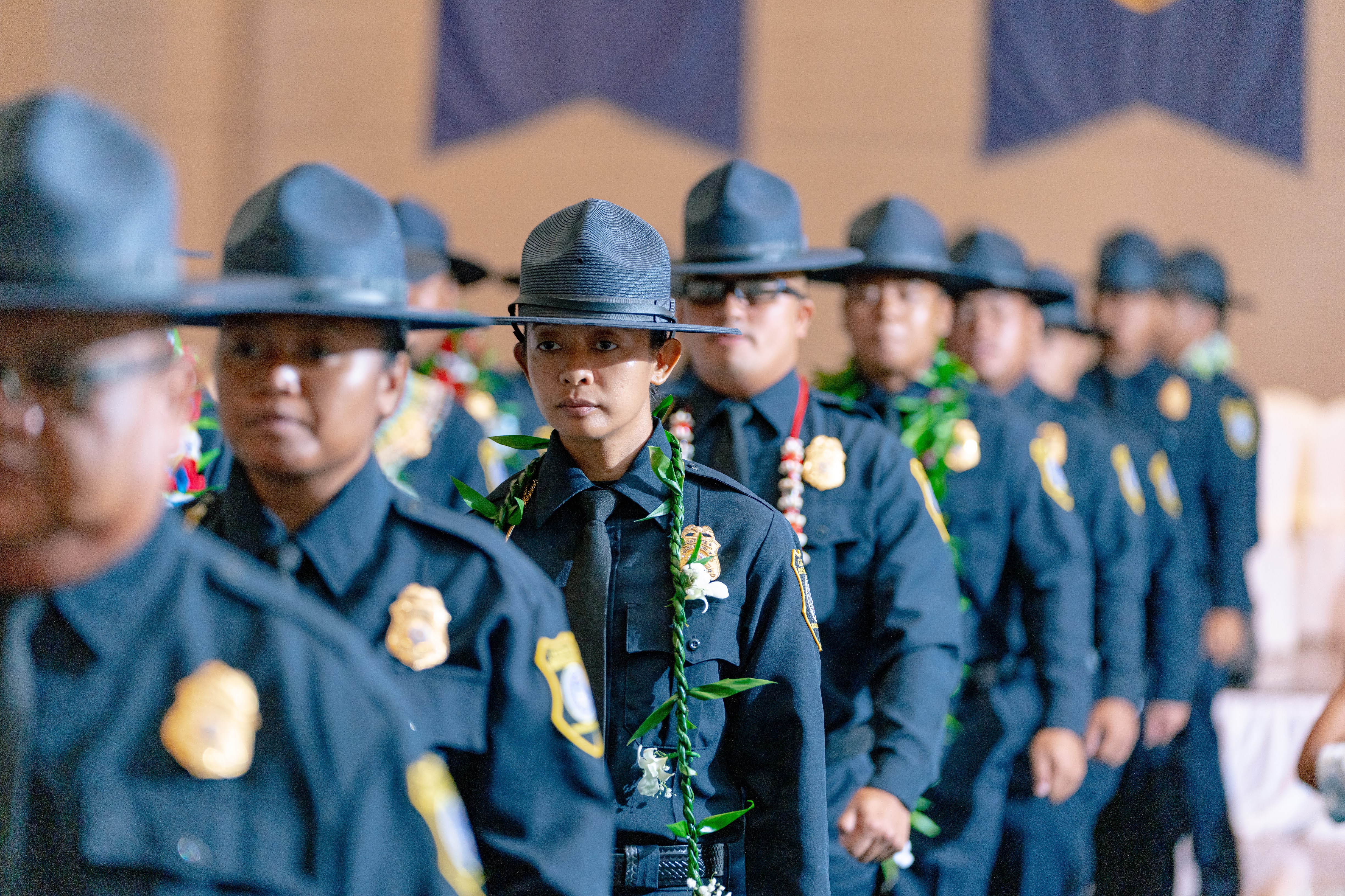 The 29 graduates of 9th Cycle Academy march out at the end of their graduation ceremony.