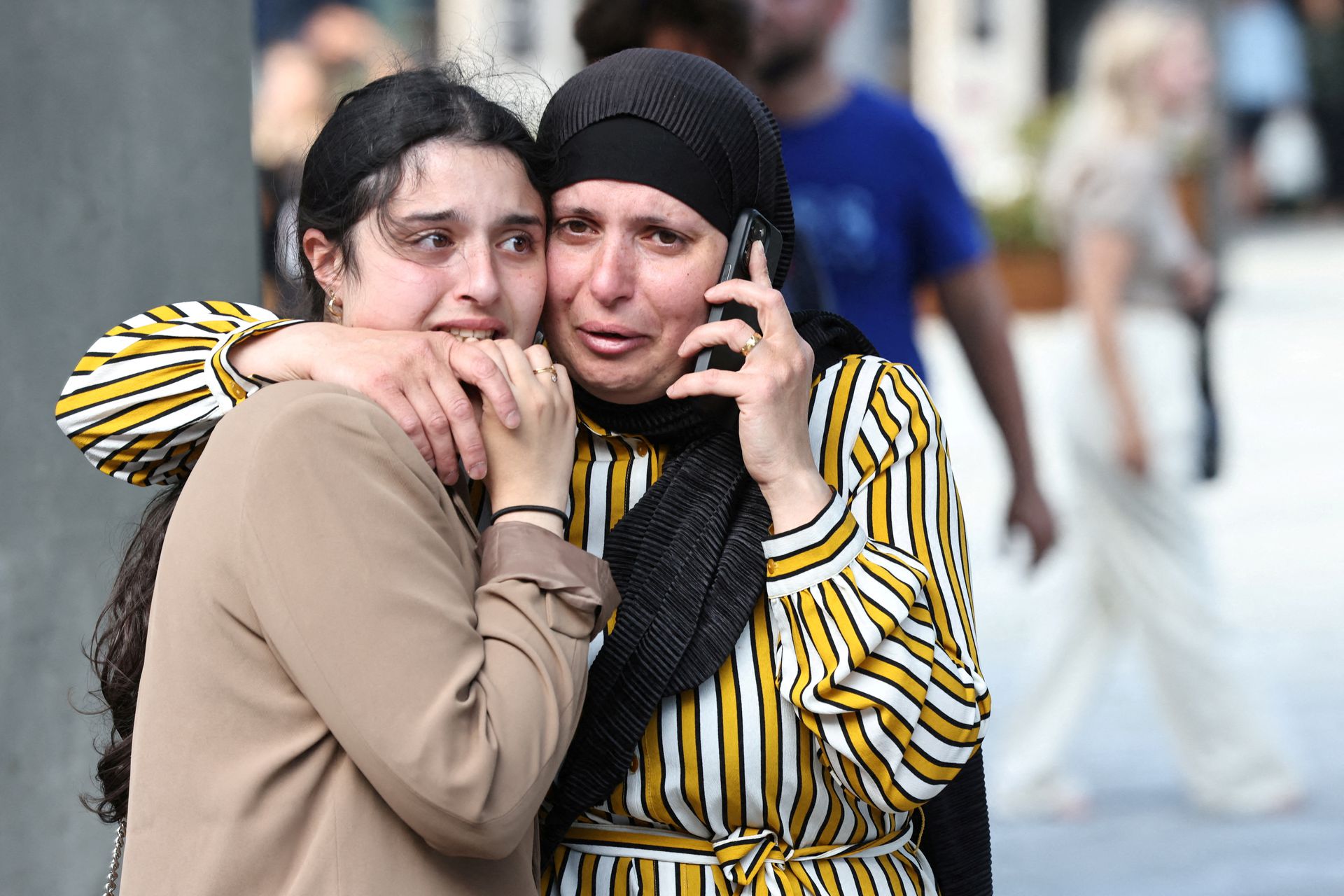 People react outside Field's shopping center, after Danish police said they received reports of shooting, in Copenhagen, Denmark, July 3, 2022.