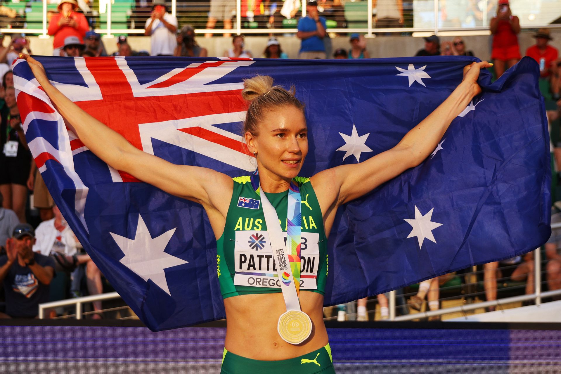 Gold medalist  Eleanor Patterson of Australia celebrates with the flag of her nation after winning the women's high jump final at Hayward Field in Eugene, Oregon, July 19, 2022.