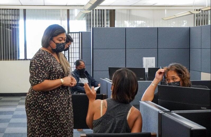The Government of Guam Relief Center officially opened its doors to the public Monday. Staff are shown assisting people Monday morning.
