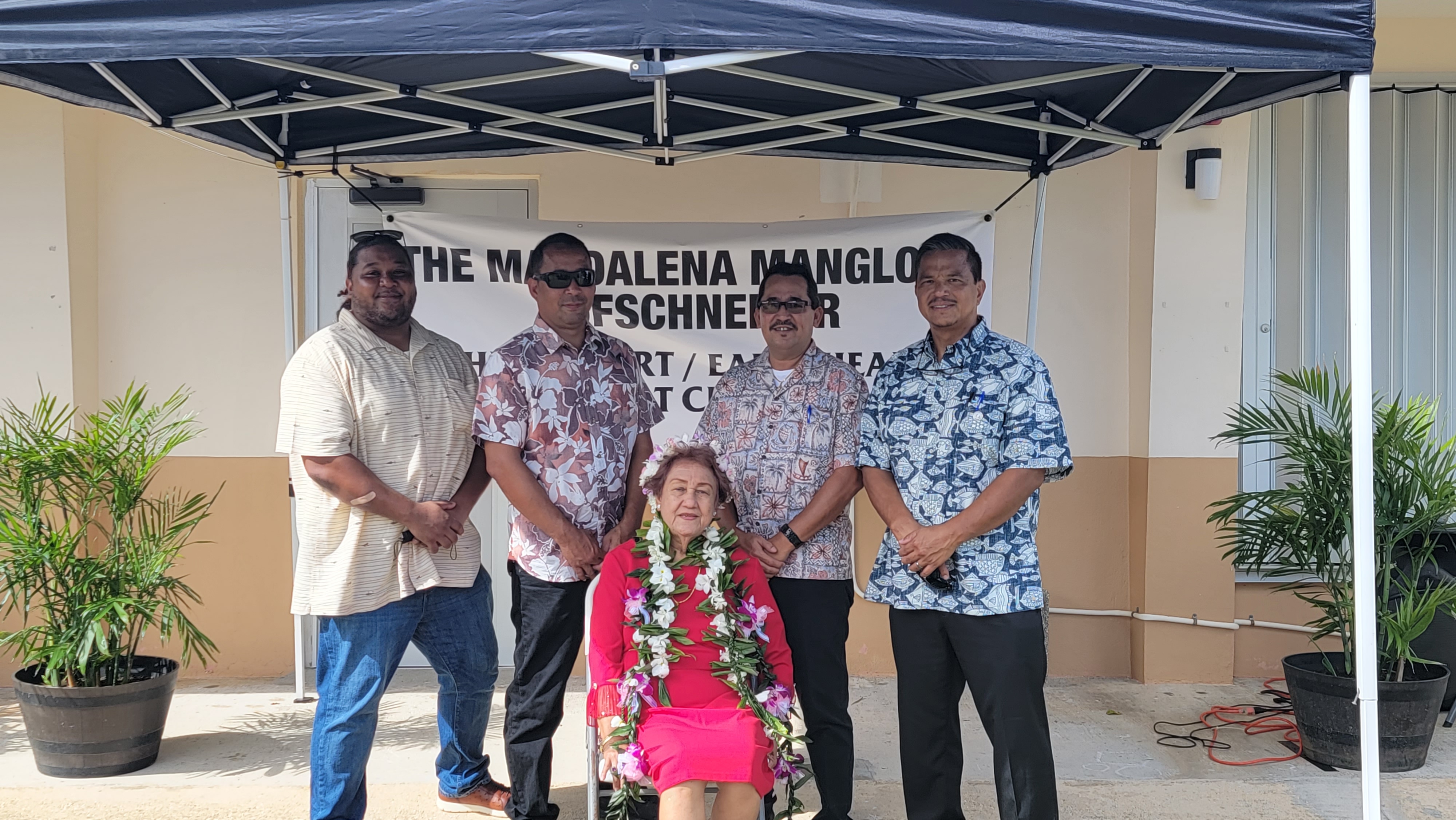 Retired educator Magdalena Muna Manglona Hofschneider, seated, poses for a photo with acting Gov. Jude U. Hofschneider, right, acting Tinian Mayor Joseph Santos, second left, Sen. Karl King Nabors, left, and Rep. Patrick San Nicolas, second right, after the signing ceremony for Public Law 22-20 which renamed the Head Start Center in San Jose, Tinian after her, on Thursday last week.