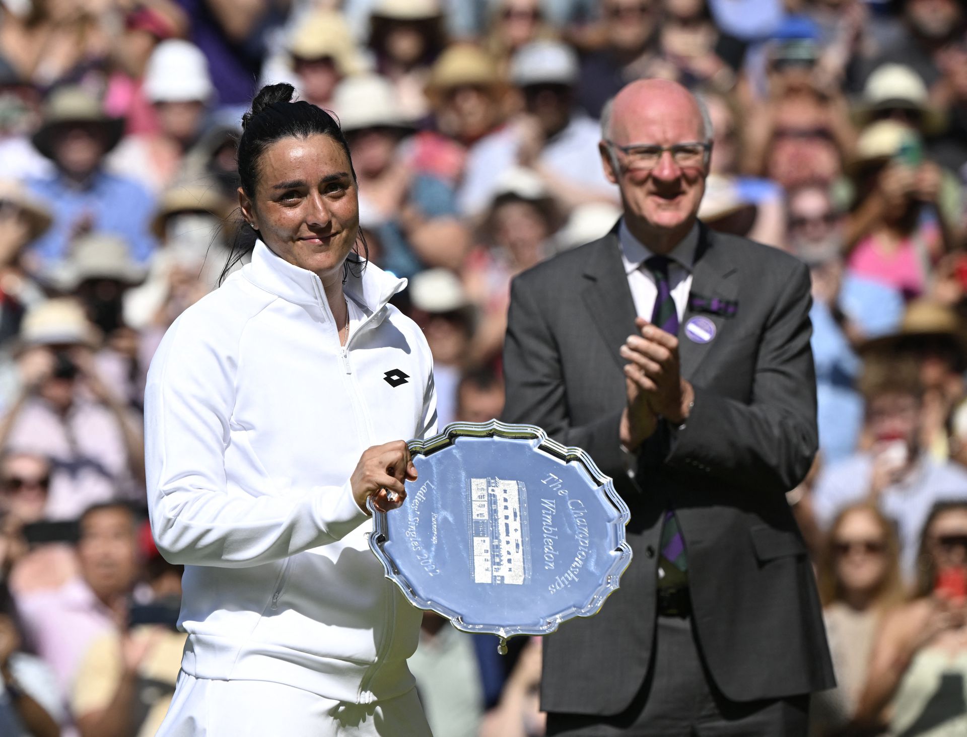 Tunisia's Ons Jabeur poses with the runner’s up trophy after losing the women's singles final against Kazakhstan's Elena Rybakina at Wimbledon in London on July 9, 2022.