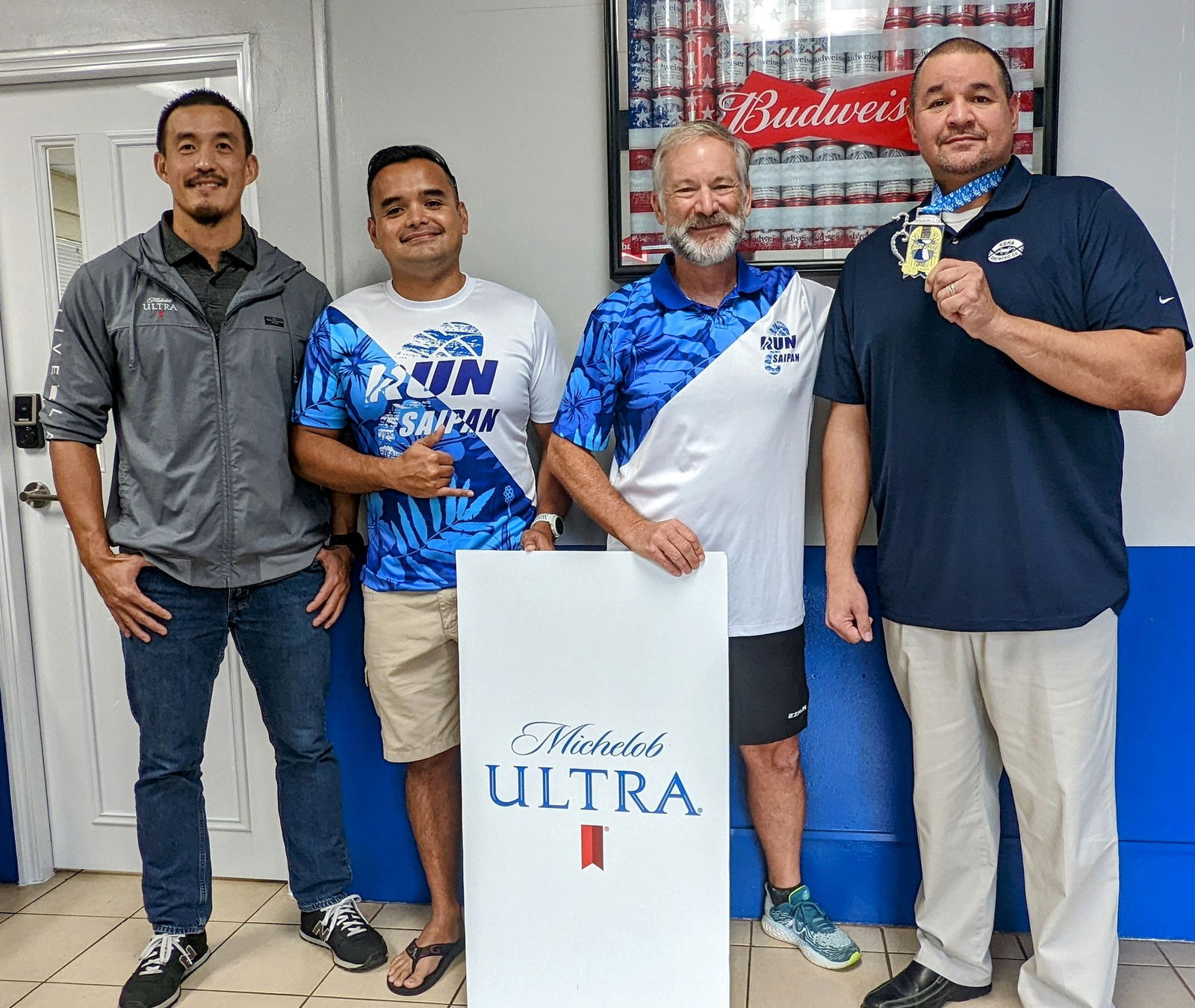From left, Marianas Pacific Distributors beverage and tobacco manager James Lee, Run Saipan president Ed Dela Cruz Jr., secretary/treasurer Ron Snyder and Marpac resident manager Guy Pudney. Michelob Ultra, which is distributed by Marpac, is the official sponsor of the first ever NMI Beer Mile set for Aug. 5, 2022.