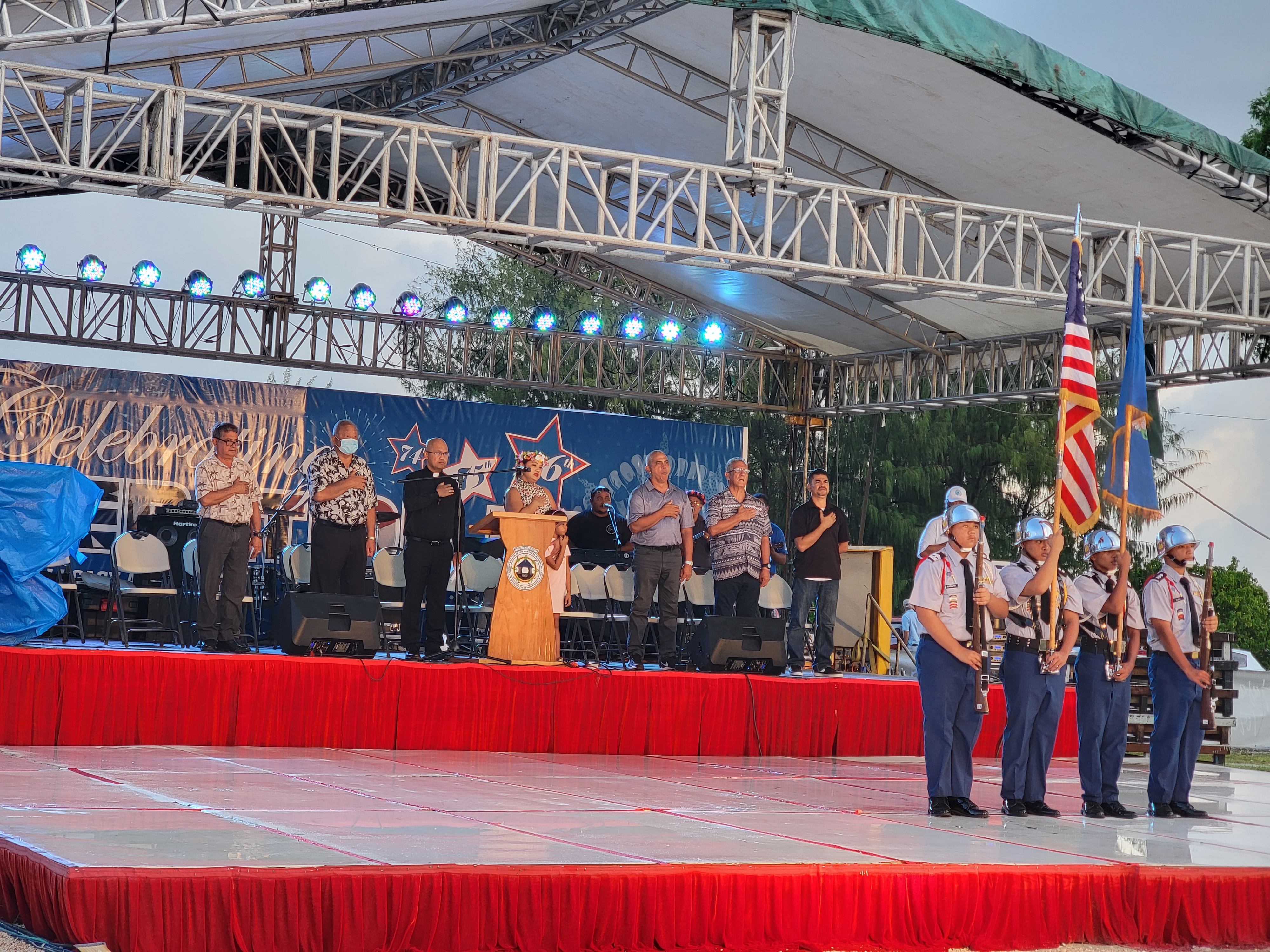 CNMI lawmakers, Saipan Mayor David M. Apatang and Bishop Ryan Jimenez sing the national anthem during the opening ceremony  of the Liberation Day festivities at the Garapan Fishing Base on Thursday.