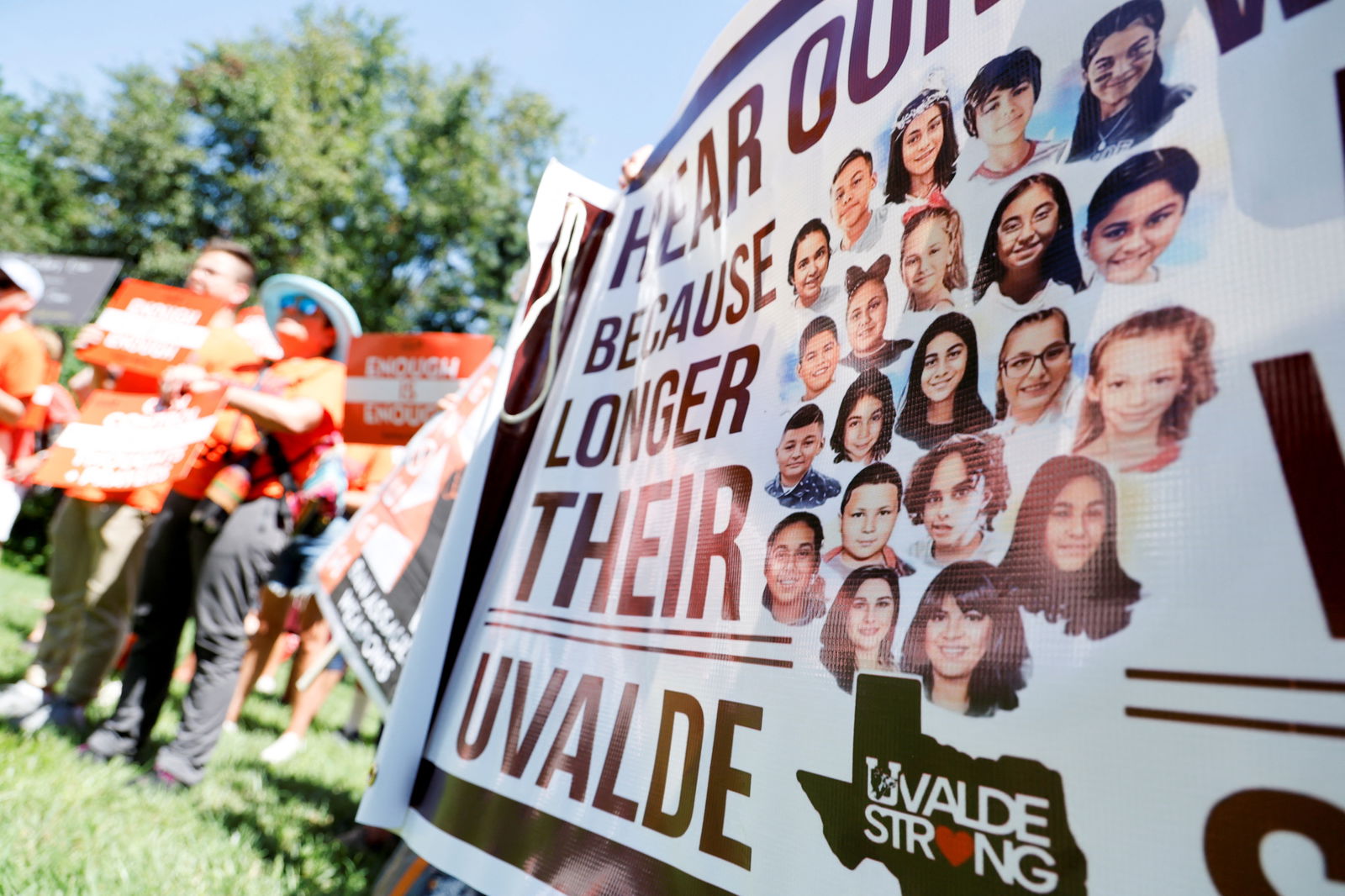 The students and teachers killed in the Uvalde, Texas, mass shooting are memorialized on a banner at the March Fourth rally against assault weapons, in response to the Highland Park parade shooting and other recent mass shootings, on Capitol Hill in Washington, D.C., July 13, 2022.