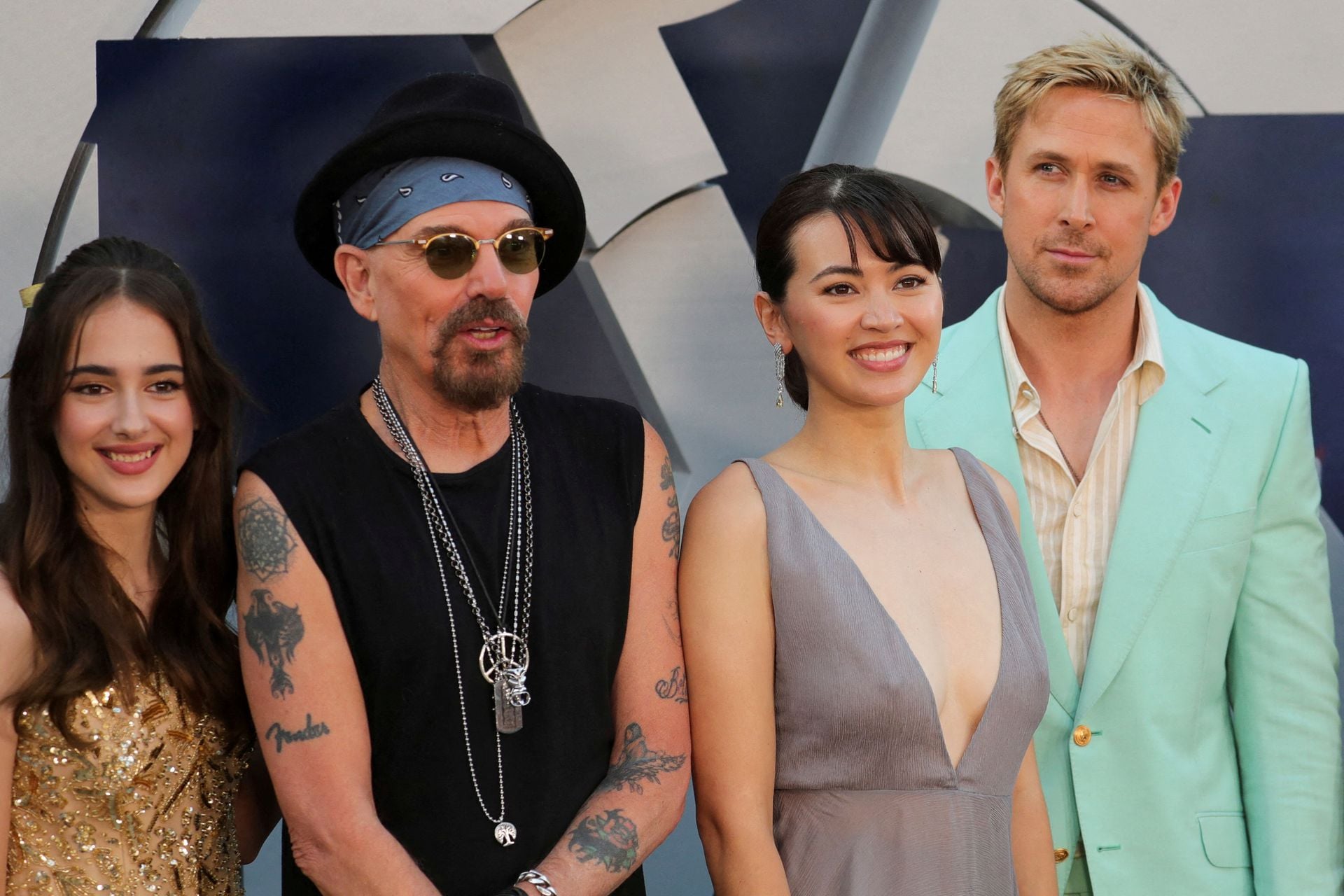 Julia Butters, Billy Bob Thornton, Jessica Henwick and Ryan Gosling pose on the red carpet before the World Premiere of Netflix's "The Gray Man" at TCL Chinese Theatre in Los Angeles, California, July 13, 2022.
