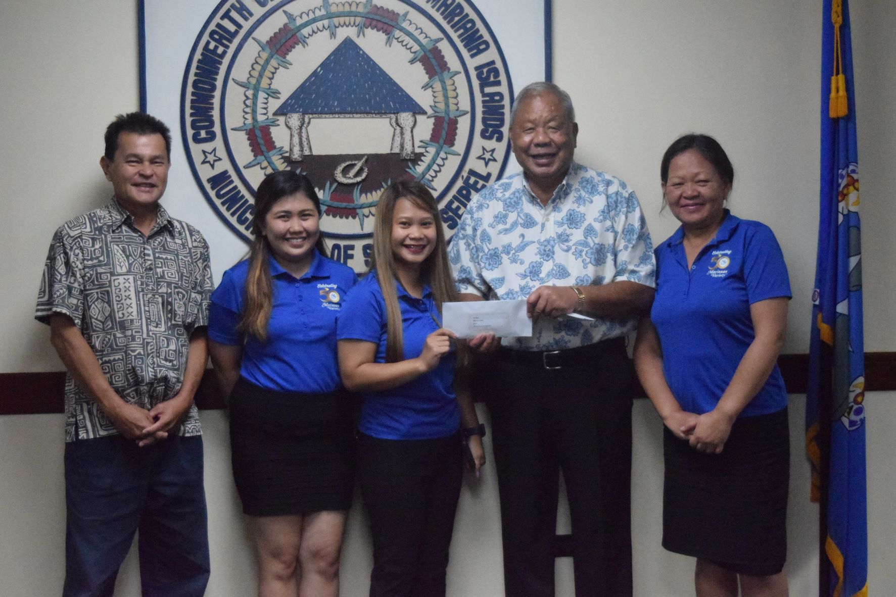 Marianas Variety sales staff Diane Lumapas, Gwen Sandig and Jeanette Sarabia receive their share of the $3,000 third prize.
