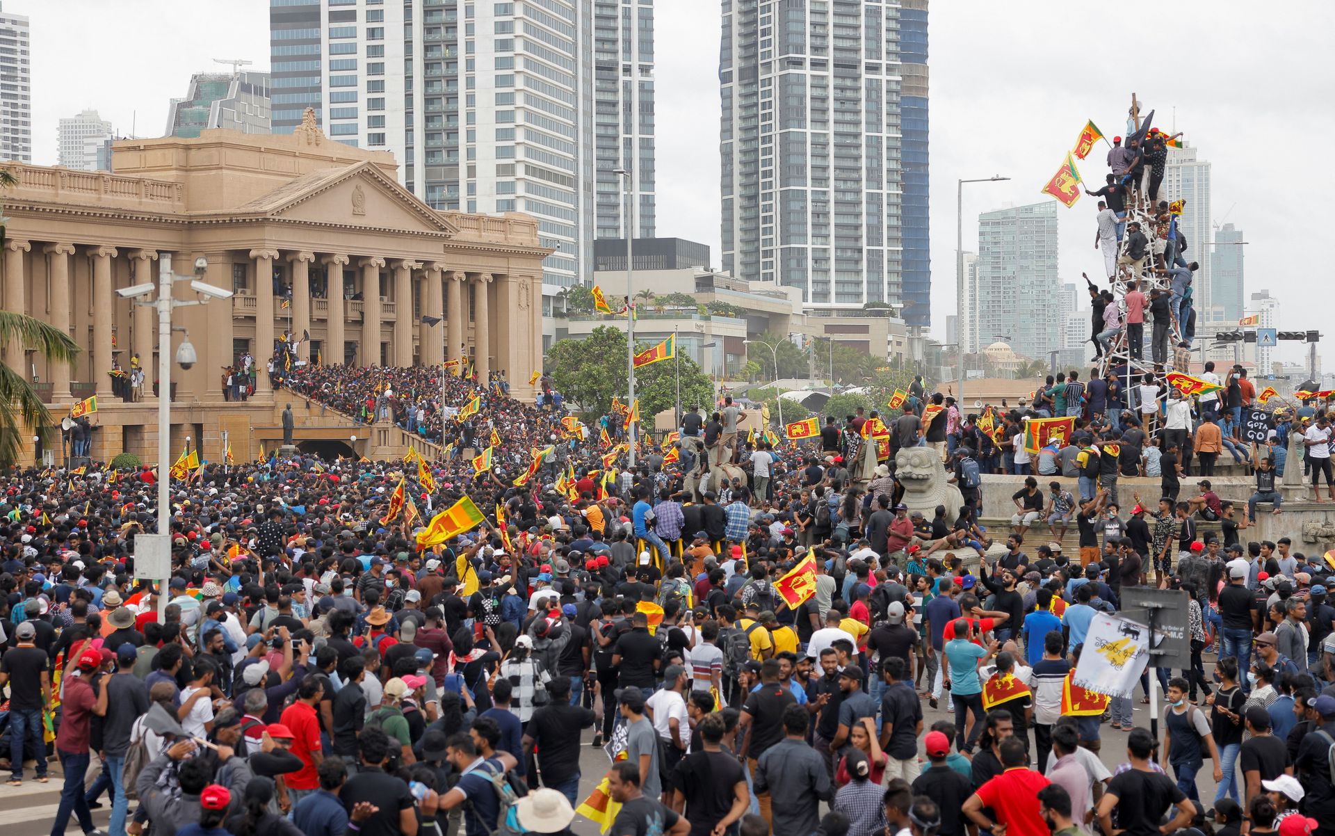 Demonstrators celebrate after entering the Presidential Secretariat during a protest, after President Gotabaya Rajapaksa fled, amid the country's economic crisis, in Colombo, Sri Lanka, July 9, 2022.
