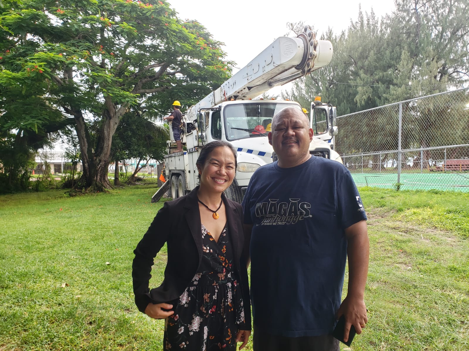 Reps. Tina Sablan and John Paul  Sablan pose for a photo near the Laly Four basketball court.