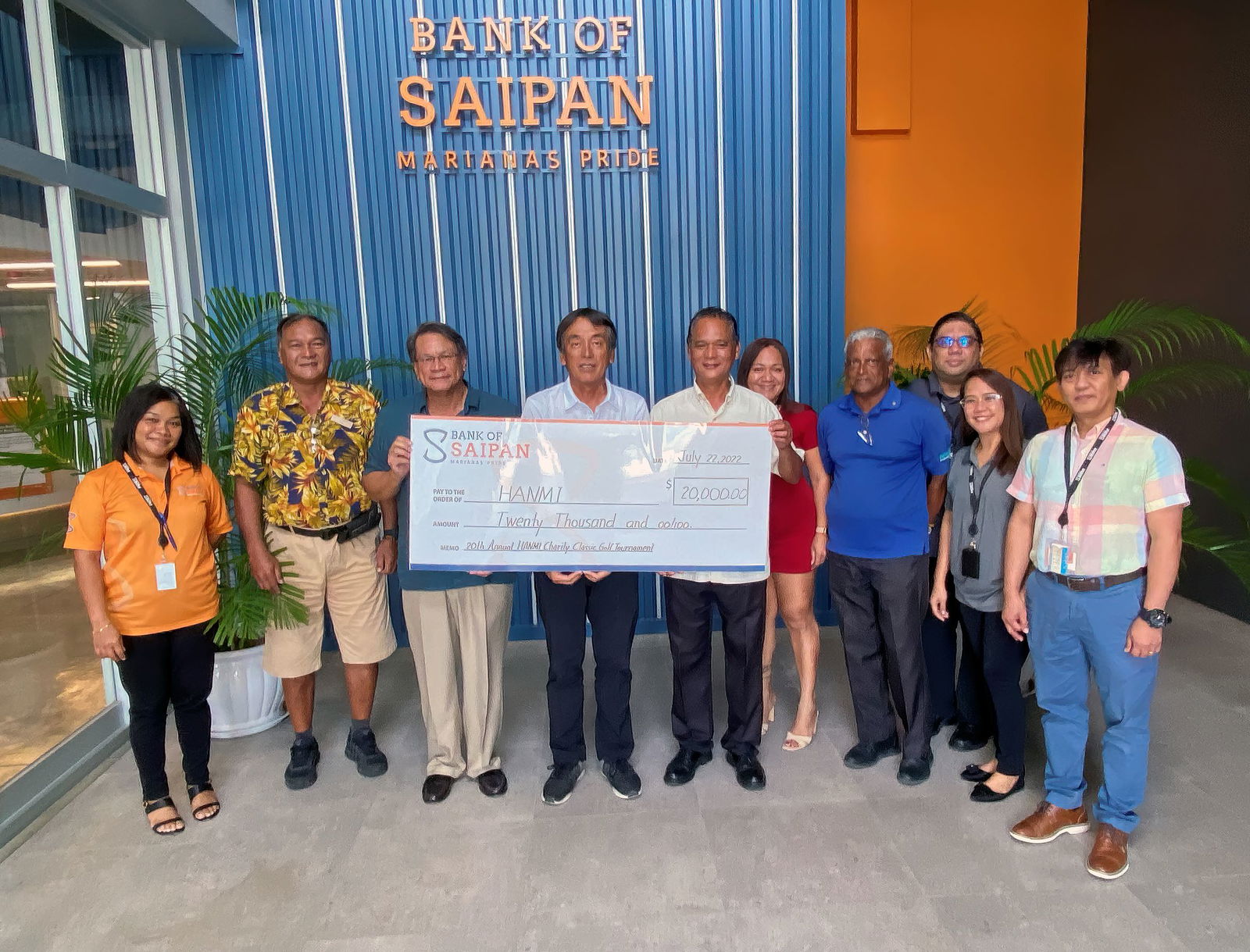Bank of Saipan President & CEO John Arroyo, third left, and staff present a $20,000 hole-in-one prize on July 22, 2022, at the bank branch in San Jose, Saipan, for the 20th Annual HANMI Charity Classic Golf Tournament.  From left, Karen Kalen, golf tournament committee member Max Concepcion, Arroyo, tournament committee chairman Juko Ishikawa, tournament committee vice chairman Neil Metran, Gina Delon Guerrero, tournament committee member Das Krishnan, Lee Tudela, Ritchell Sublemente, and Arnold Pascua.