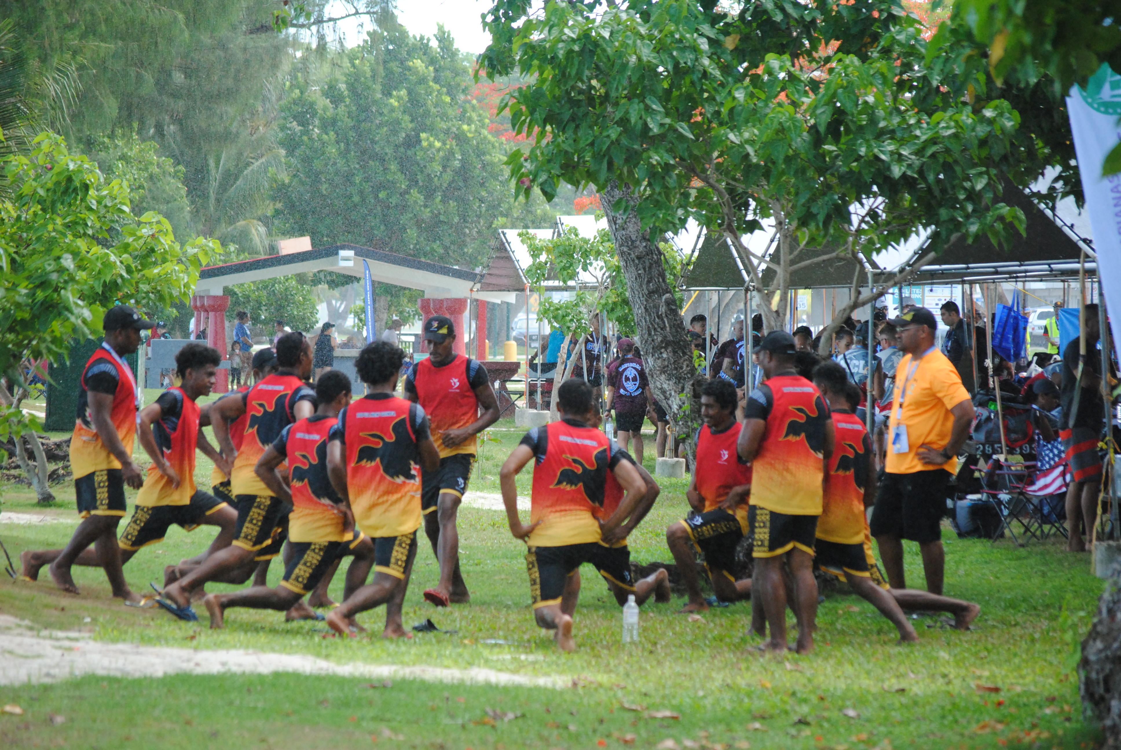 Members of Team Papua New Guinea gather for a pre-race huddle during the Va'a event of the 2022 Pacific Mini Games on June 20, 2022 at Kilili Beach.