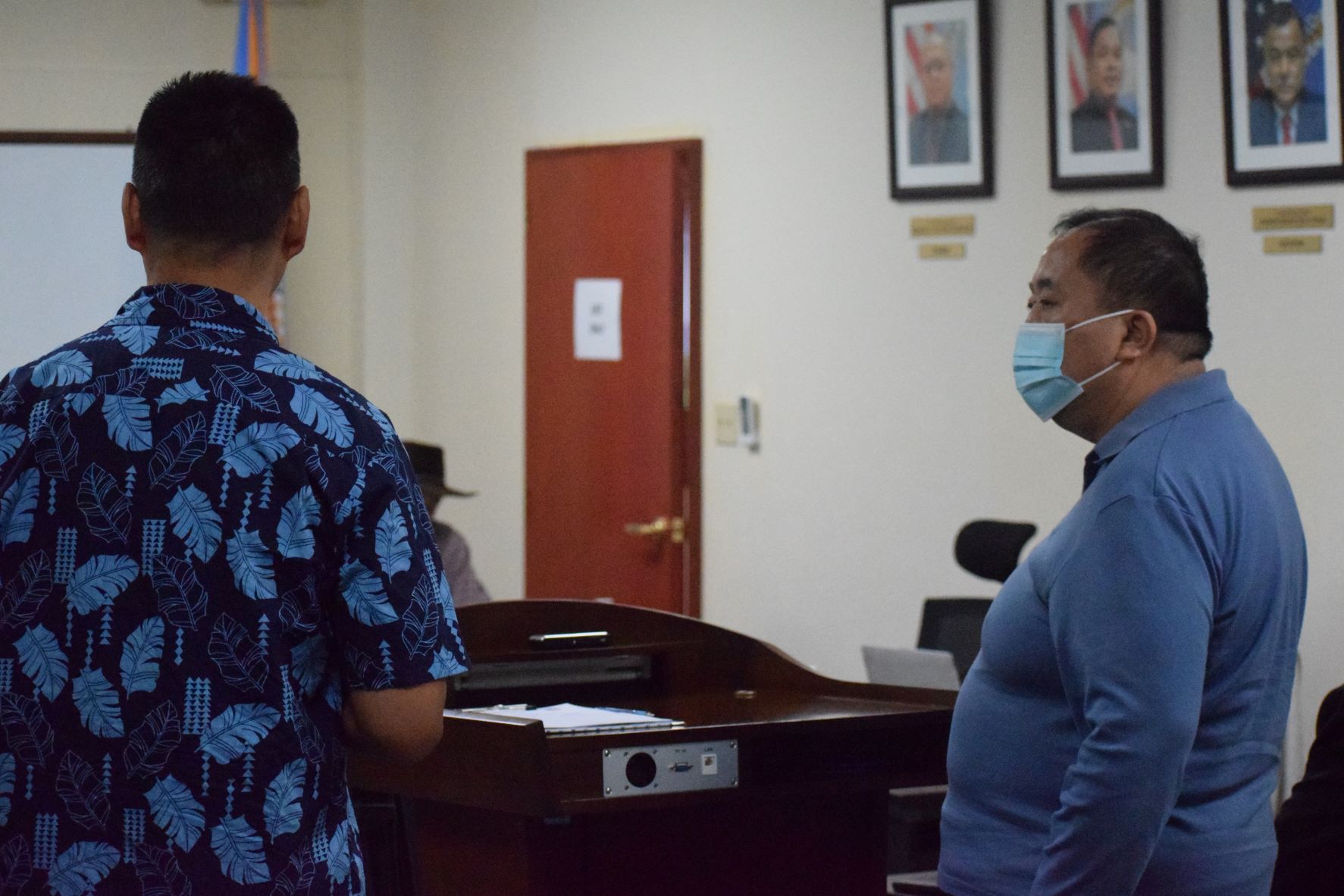 Imperial Pacific International senior adviser Hongtao Su, right, looks on as fellow IPI adviser, Tao Xing, left, translates Su's statement to the Commonwealth Casino Commission during a meeting in its conference room in Gualo Rai on Thursday.