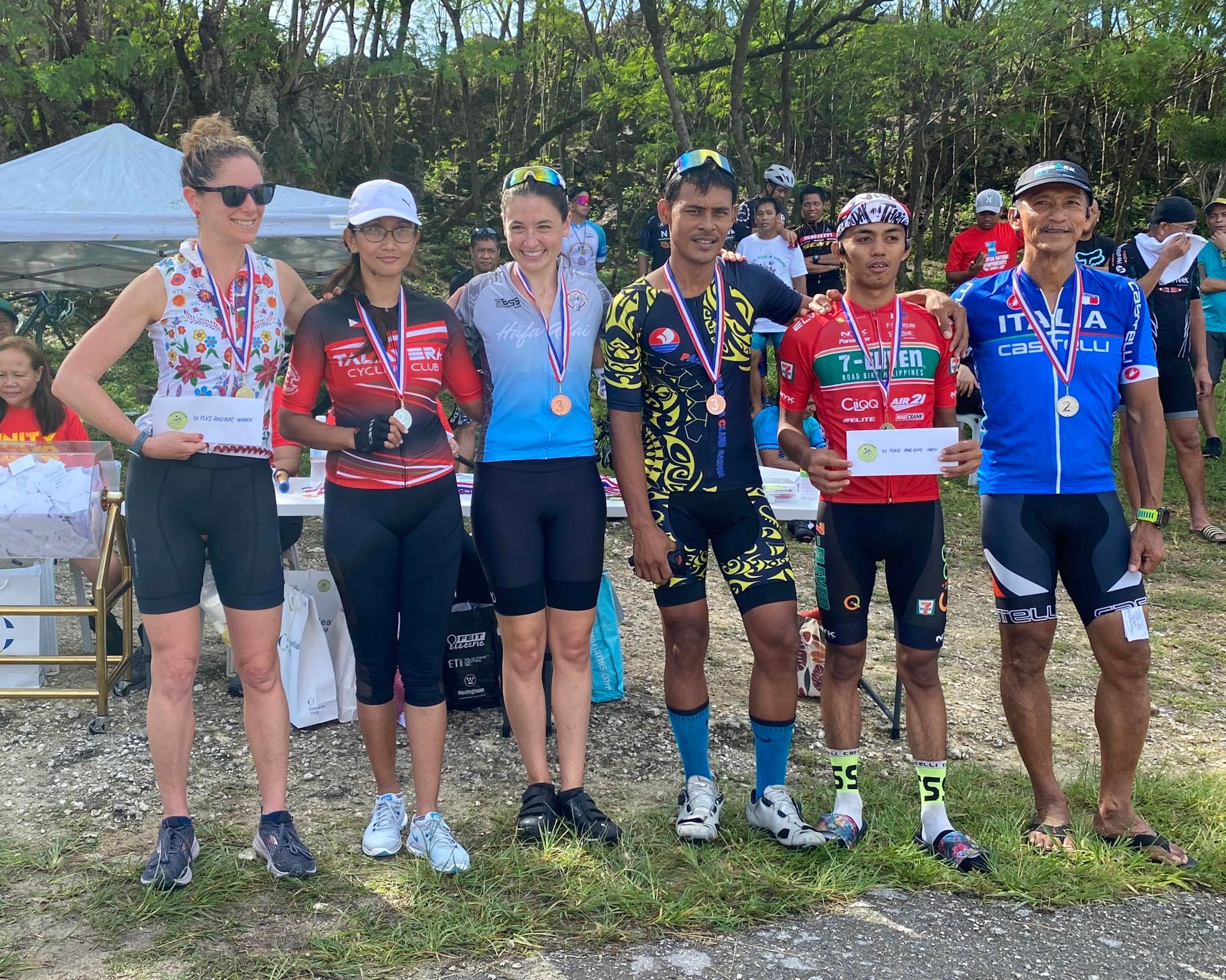 Lily Muldoon, Jay Anne Felipe, Heather Brook, Mark Isip, Renren Gaviola and Red Remillosa pose for a photo with their medals at the conclusion of the 2nd Annual Bike Race For A Cause Sunday at Suicide Cliff.