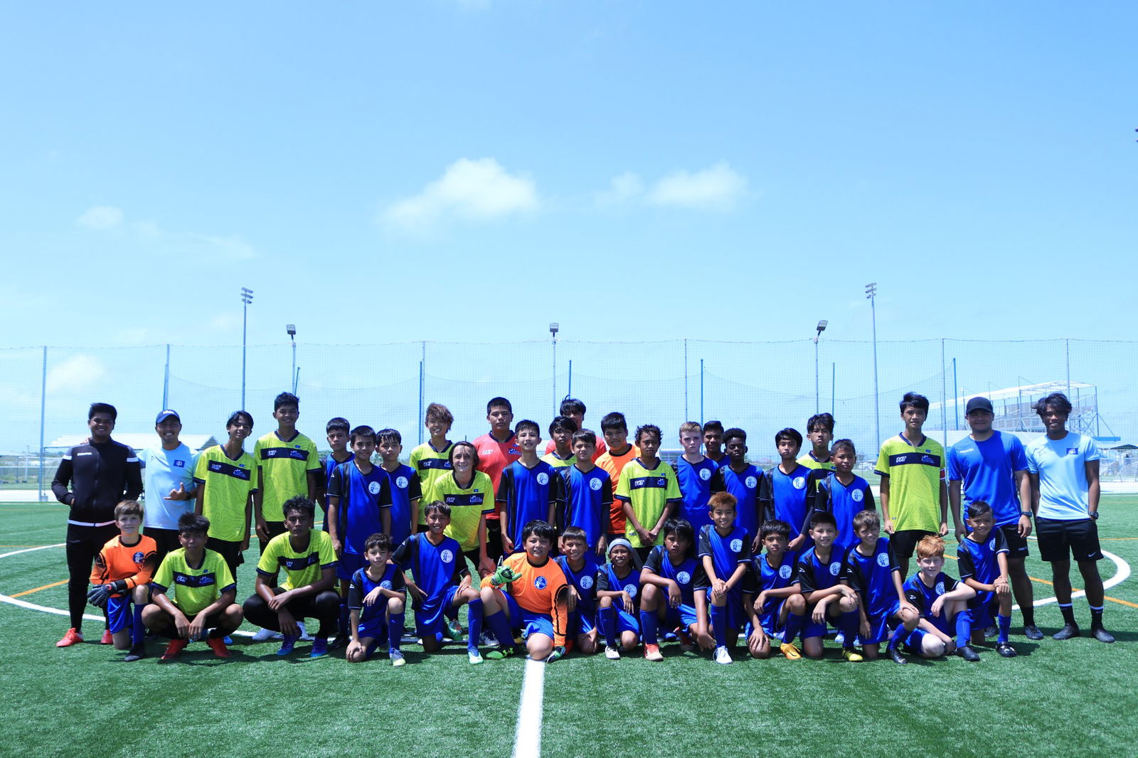 The NMI U15 and Guam U14 players pose for a photo after their friendly game on June 26, 2022 at the NMI Soccer Training Center.