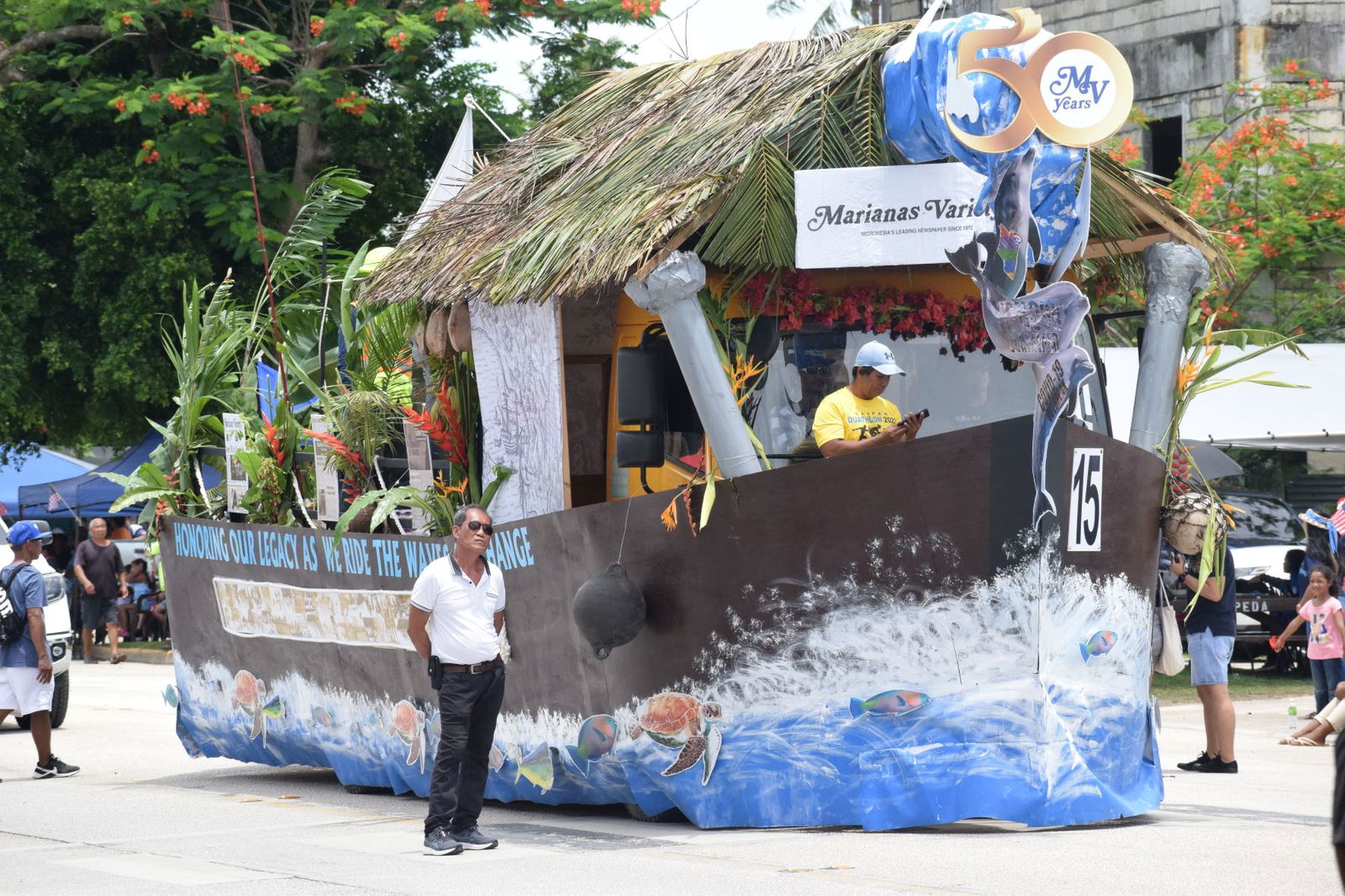 Marianas Variety's float depicts a boat on a "wave of change."