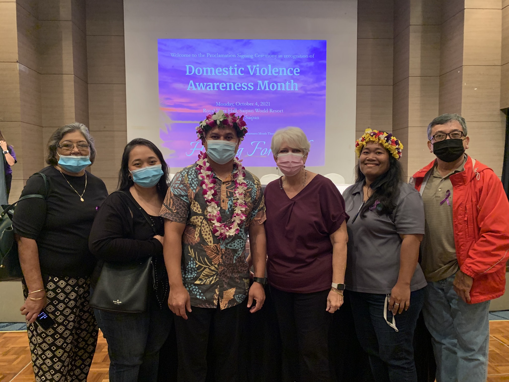 Calvani P. Deleon Guerrero, third left, is flanked by his coworkers from Karidat Social Services after the Domestic Violence Awareness Month Proclamation Ceremony where he was named the recipient of the 2021 Bridge of Light Award.