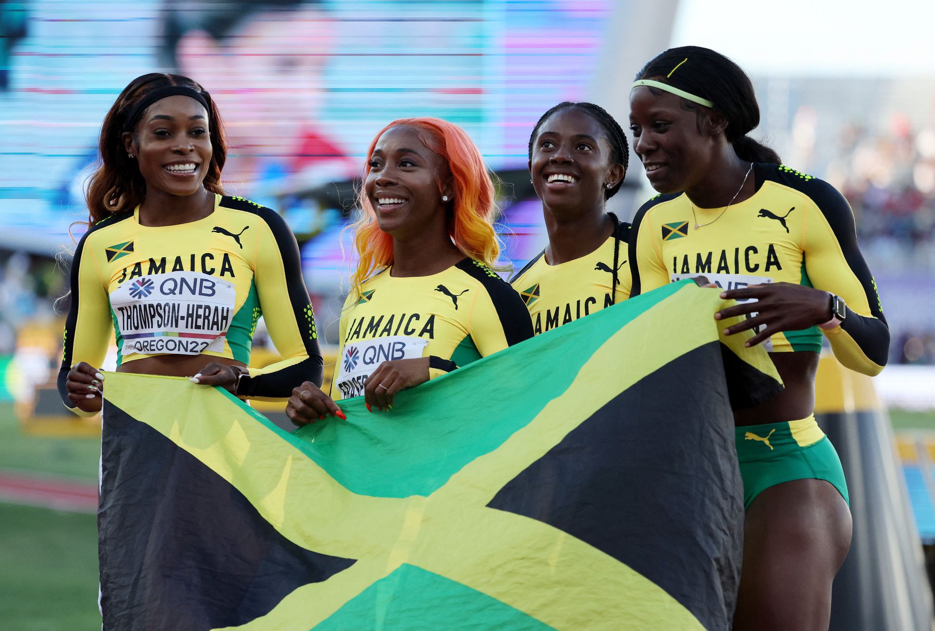 Jamaica's Elaine Thompson-Herah, Shelly-Ann Fraser-Pryce, Kemba Nelson and Shericka Jackson celebrate after finishing the women's 4x100 meters relay final in second place in the World Athletics Championships at the Hayward Field in Eugene, Oregon, July 23, 2022.