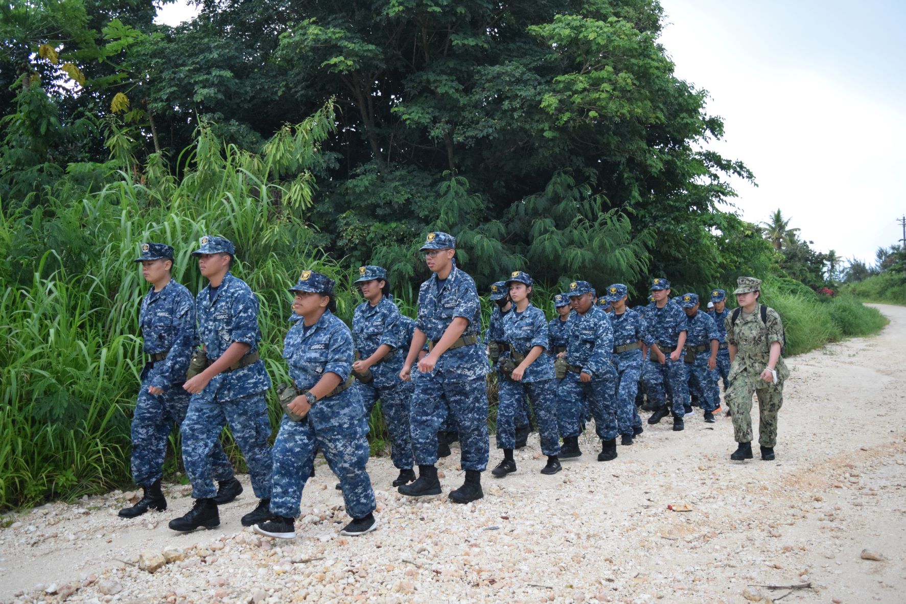 Under the command of Petty Officer Tuyet Lam Thai, the NMI's Sea Cadets and Navy League Cadets march to Mount Tapochao on Wednesday as part of their training. 
