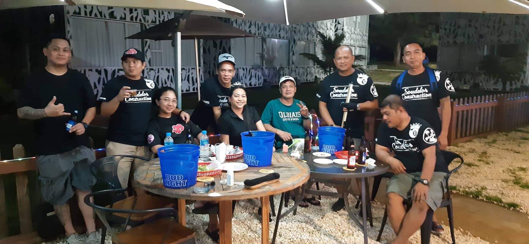 The Bamboo Soudelor Construction team members pose for a photo during a break from a Thursday Division game of the SBA Budweiser Open 8-Ball League at the New Bamboo Bar of Saipan Vegas.