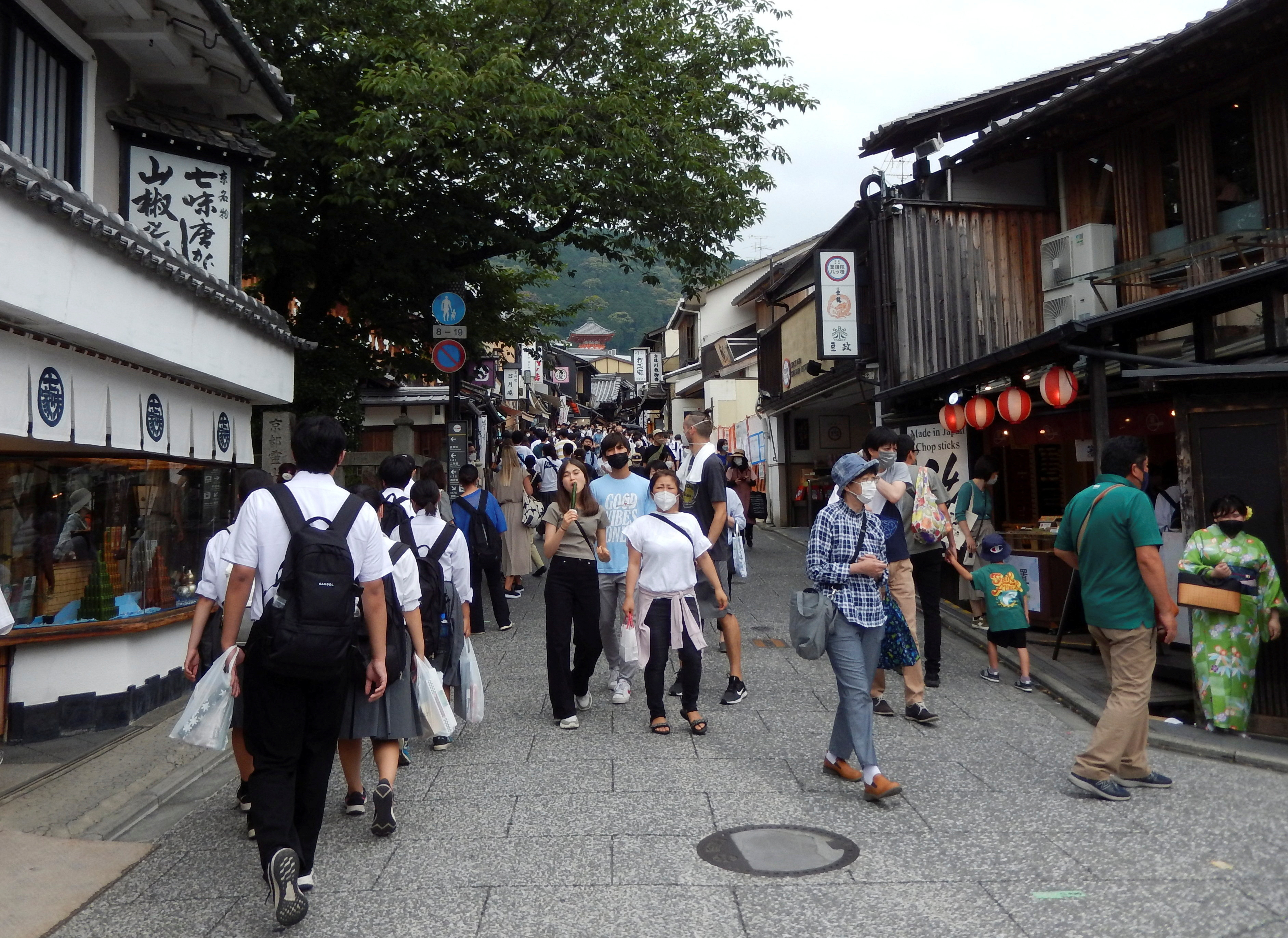 People stroll near Kiyomizu-dera temple, a popular attraction among tourists, in Kyoto, western Japan, June 18, 2022.