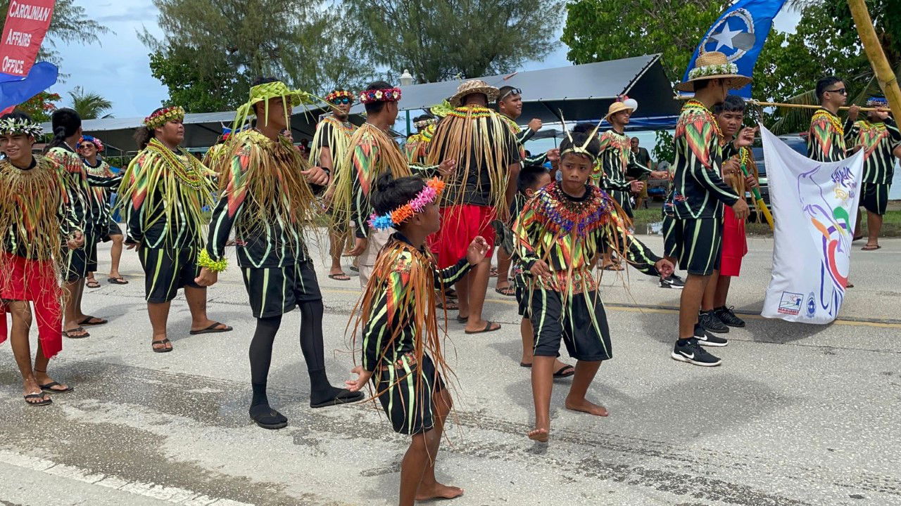 Members of the Carolinian community perform a cultural dance during the parade.