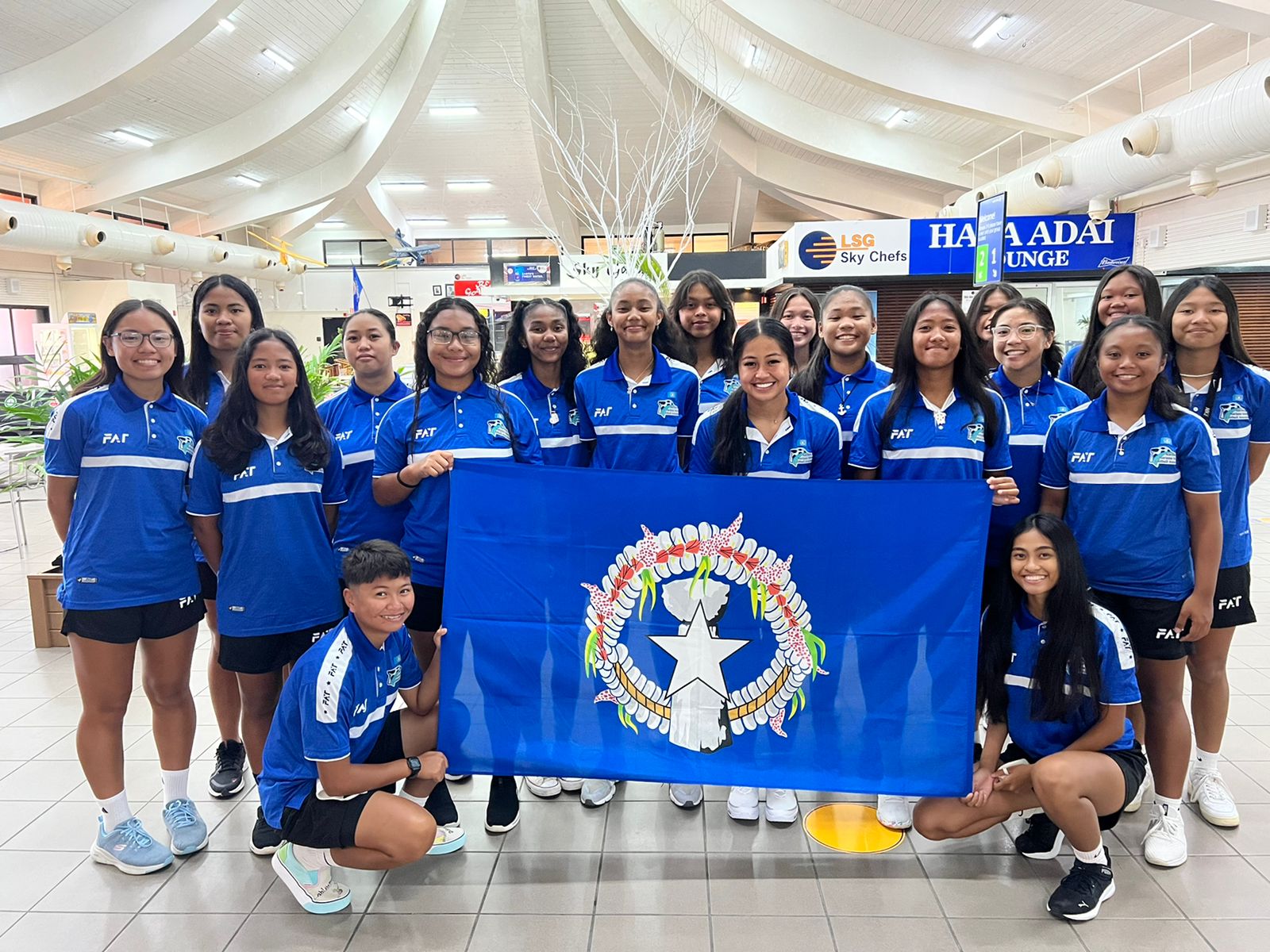 Players of the NMI Women’s National Team pose for a group photo at the Francisco C. Ada/Saipan International Airport before leaving for Guam for a weeklong training camp.