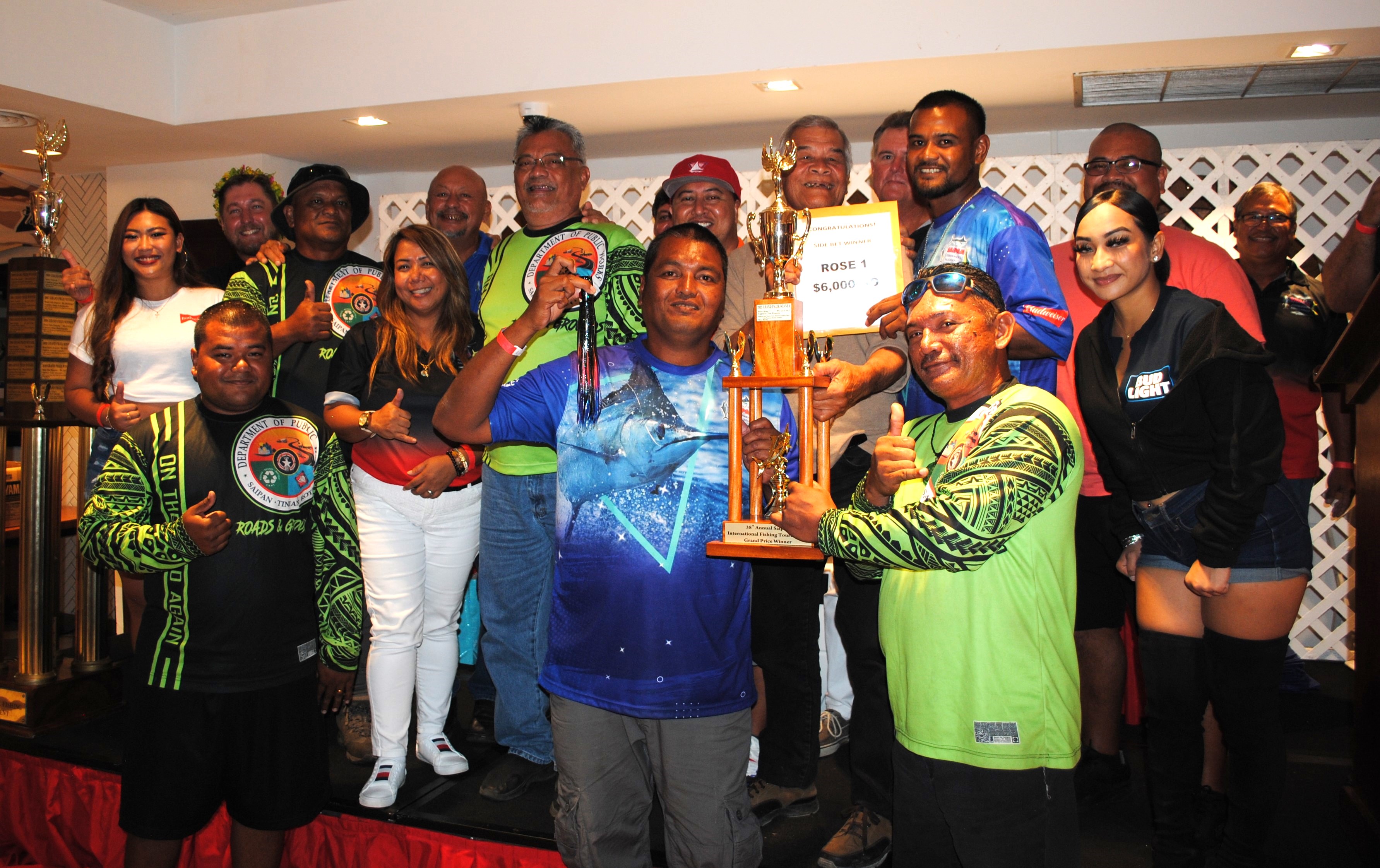 Rose 1 crewmembers pose with their grand prize trophy along with Saipan Fishermen’s Association members and Gov. Ralph DLG Torres during the awards banquet of the 38th Saipan International Fishing Derby on Sunday at PIC.r.