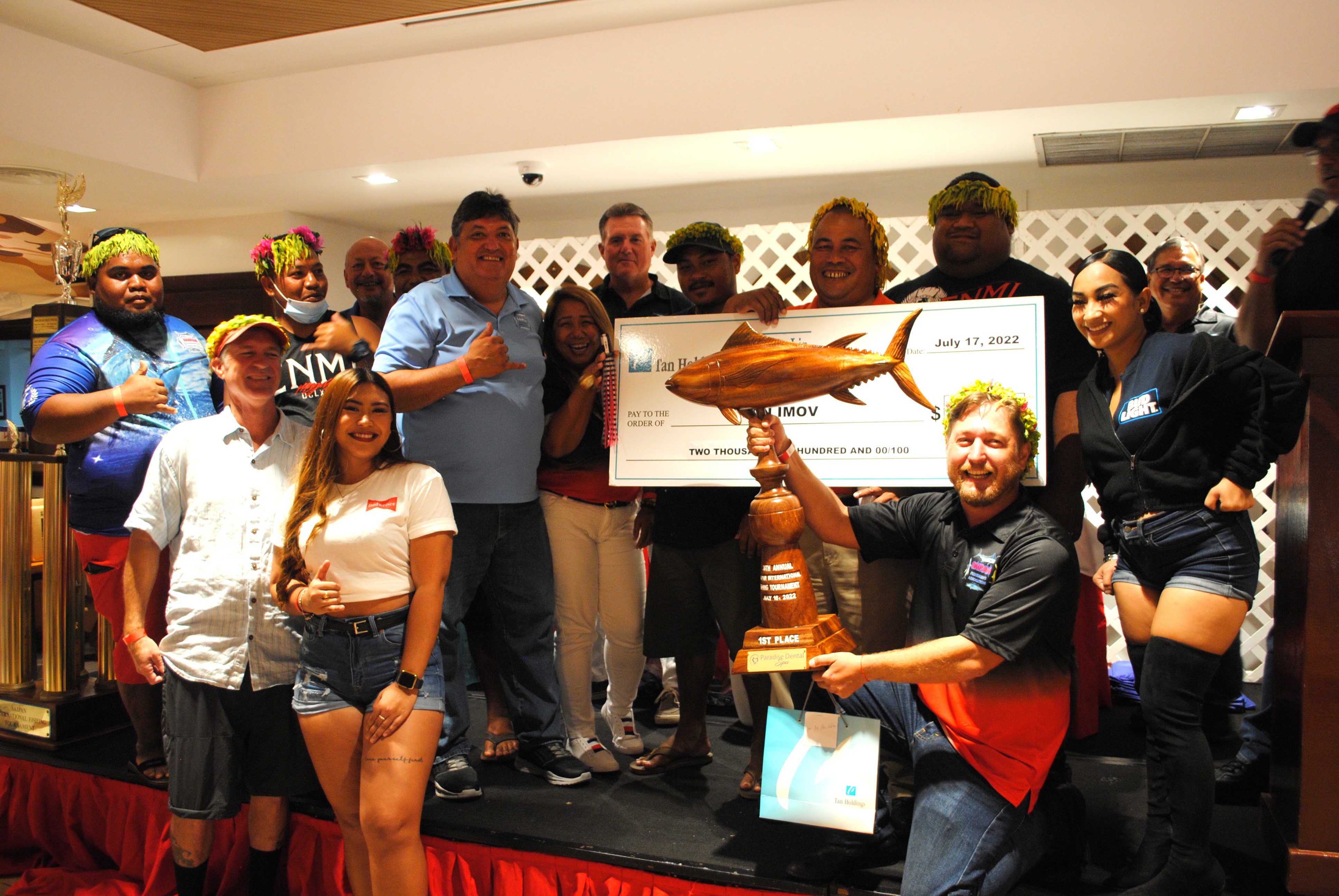 The crewmembers of Robalo pose for  a photo after receiving a check for $2,500 and the first-place trophy in the yellowfin category of the 38th Saipan International Fishing Derby during the awards ceremony at PIC on Sunday.