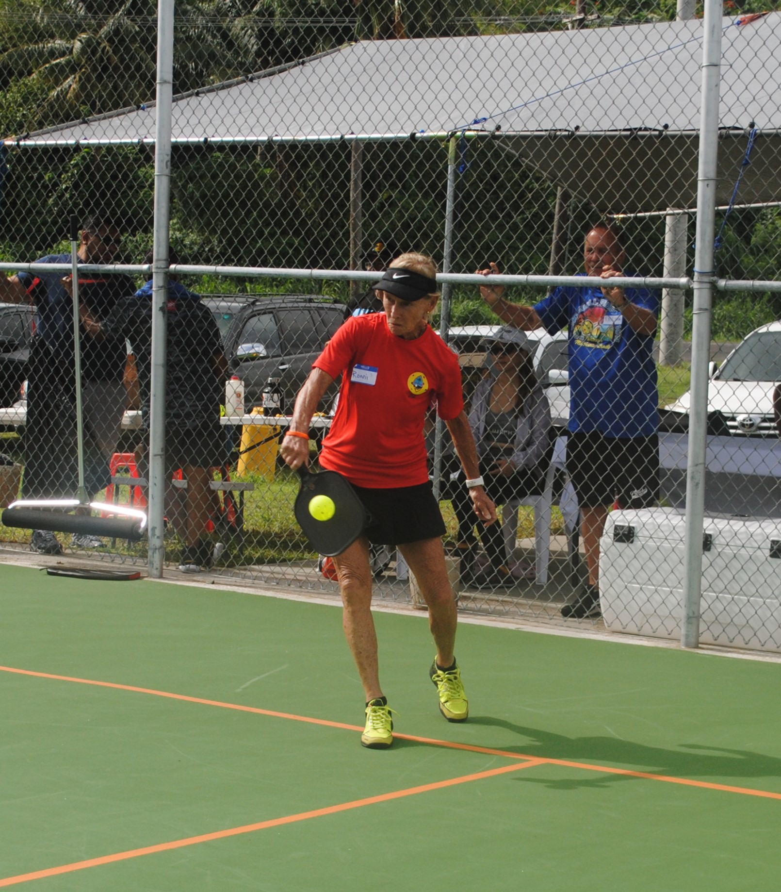 Pickleball Guam Association president Ronni Connelly connects the backhand return.