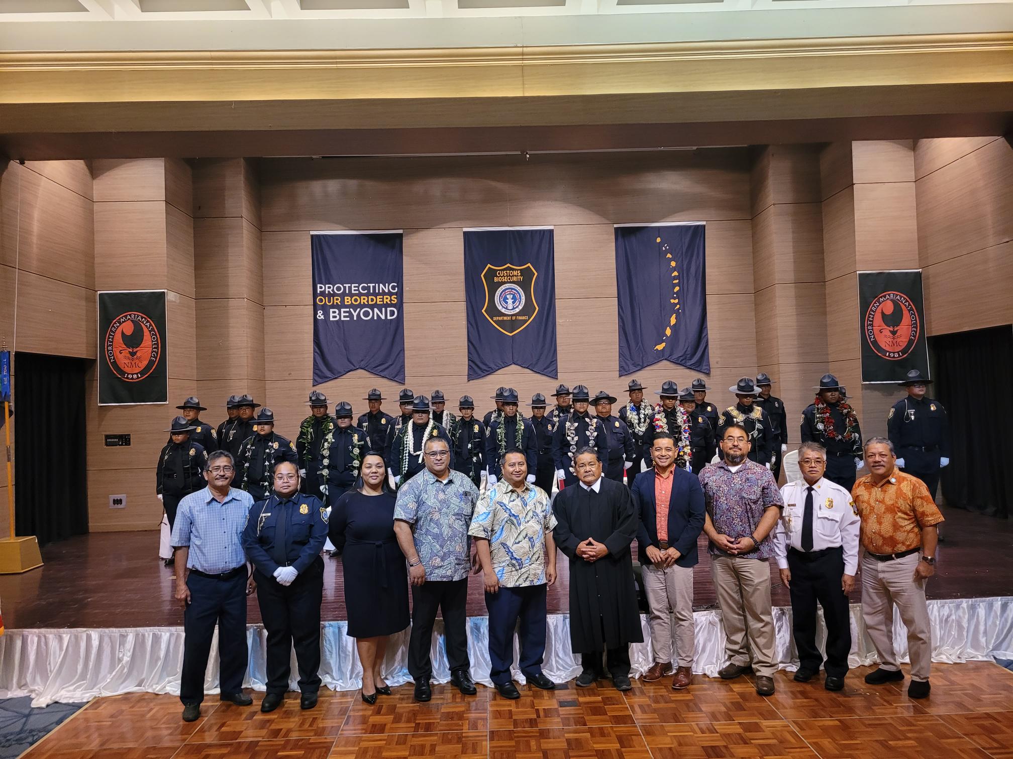 The new Customs officers pose for a photo with CNMI government and Customs officials.