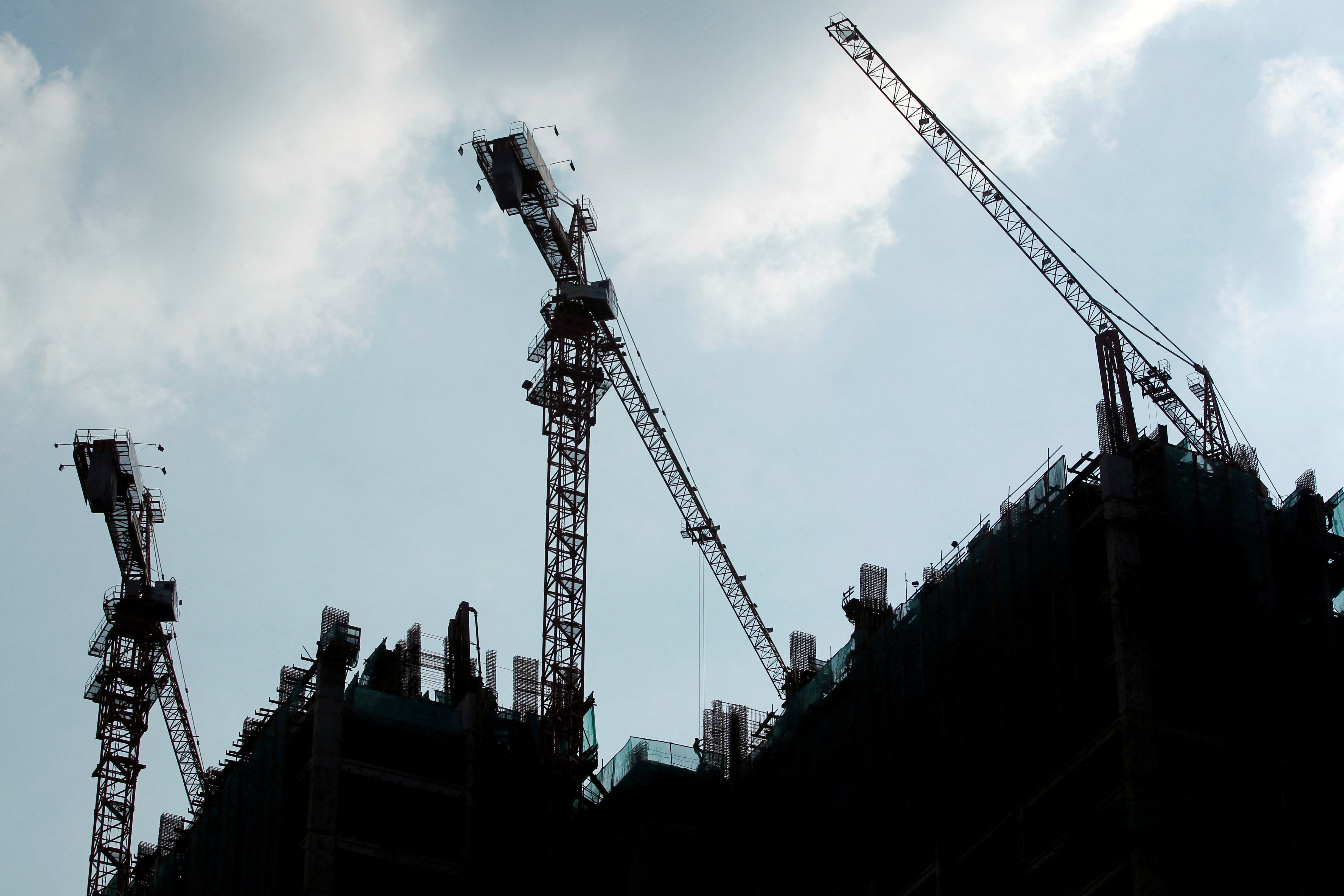 Workers work at the construction site of a new apartment in Jakarta, Indonesia, July 27, 2016. 