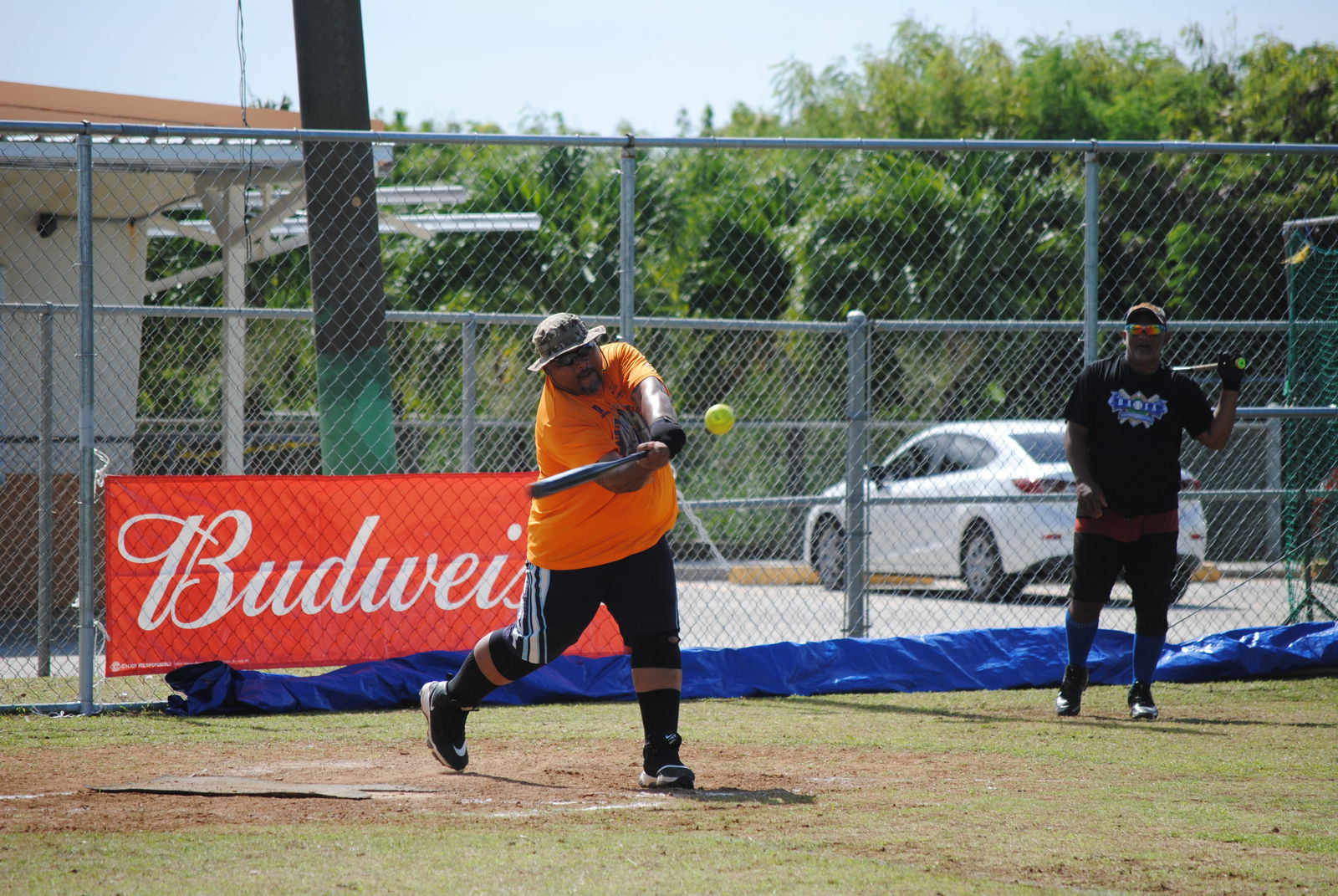 Aimeliik High Voltage's Sus Takano connects the hit for a single during a 2022 Budweiser Belau Amateur Softball League game Sunday at the Dandan baseball field.