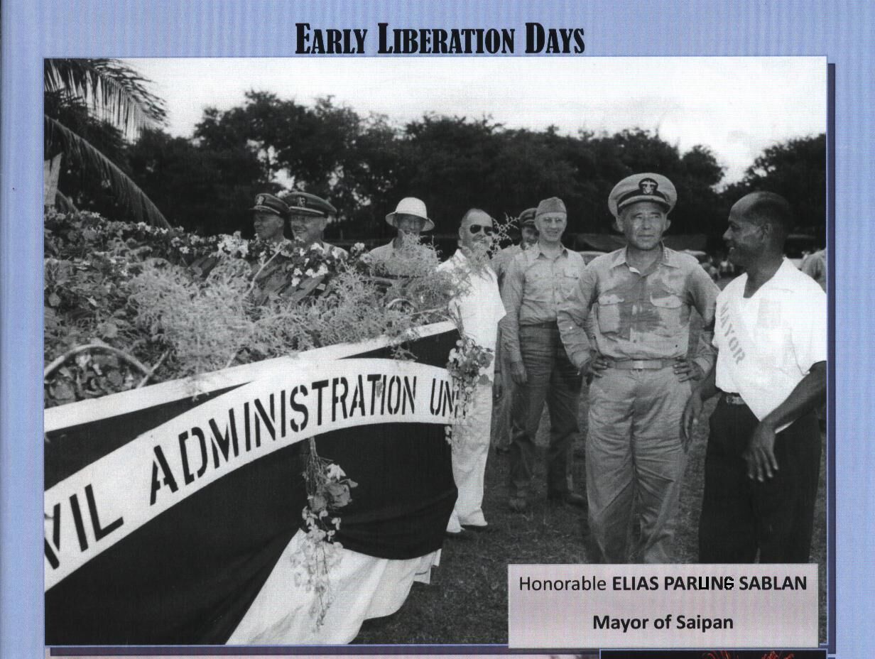 Saipan Mayor Elias Parong Sablan, right, with Admiral Ramsey and other U.S. military officials.