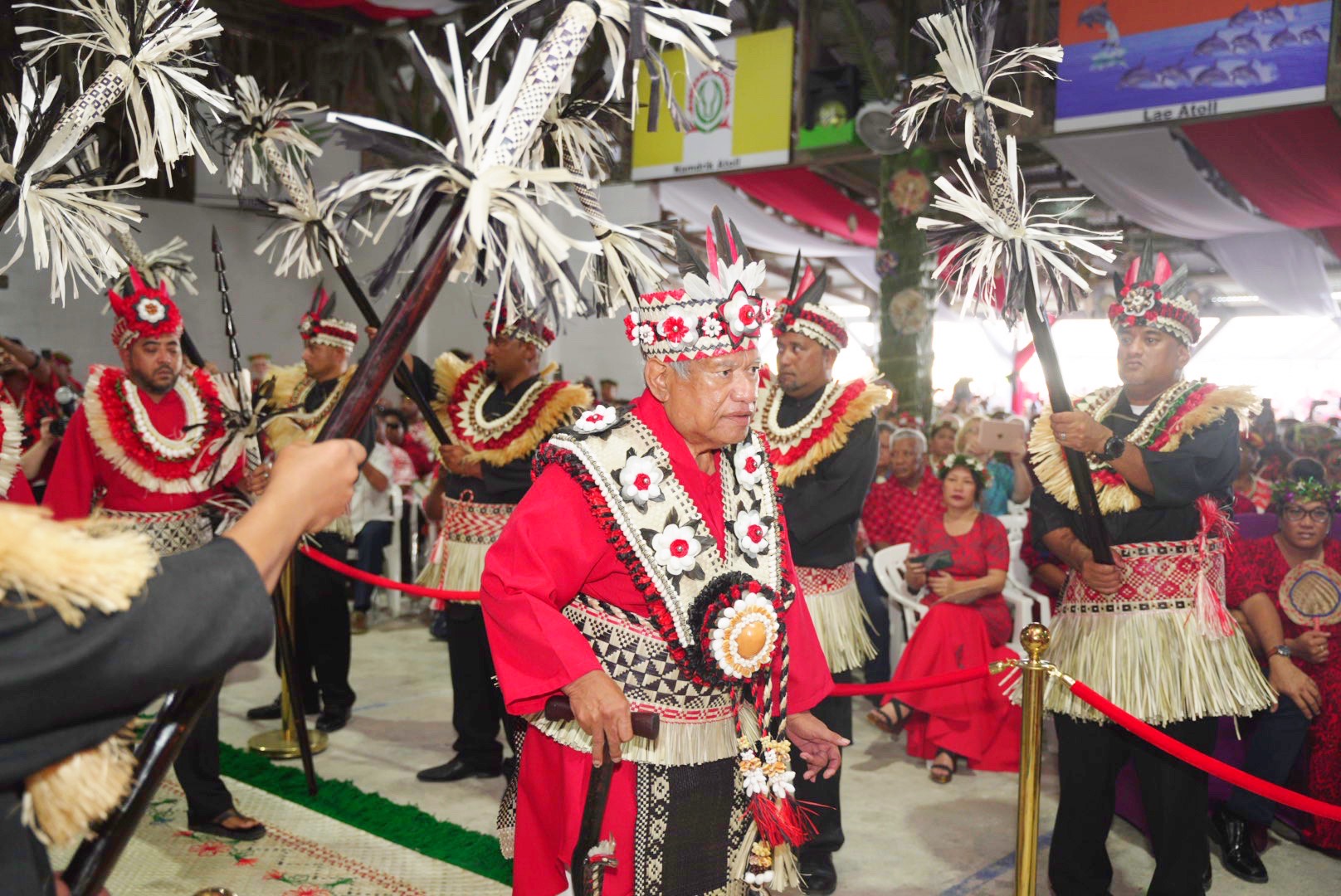 Iroojlaplap or paramount chief Michael Kabua walks through an honor guard of spear-holding warriors representing the 12 atolls and single islands in his domain at the start of a gala coronation ceremony in the Marshall Islands Thursday night. Thousands of people were on hand to witness the event, the first Kabua royal family coronation in half a century.