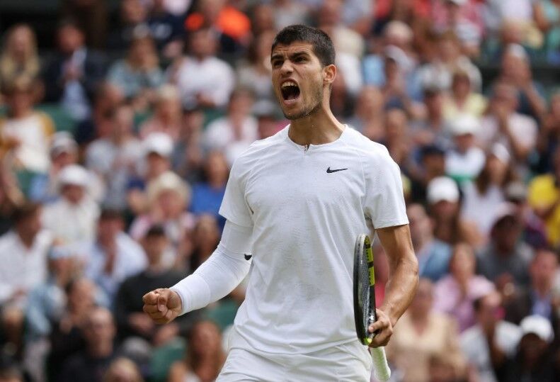 Spain's Carlos Alcaraz reacts during his fourth round match against Italy's Jannik Sinner at Wimbledon in London, Britain on July 3, 2022.