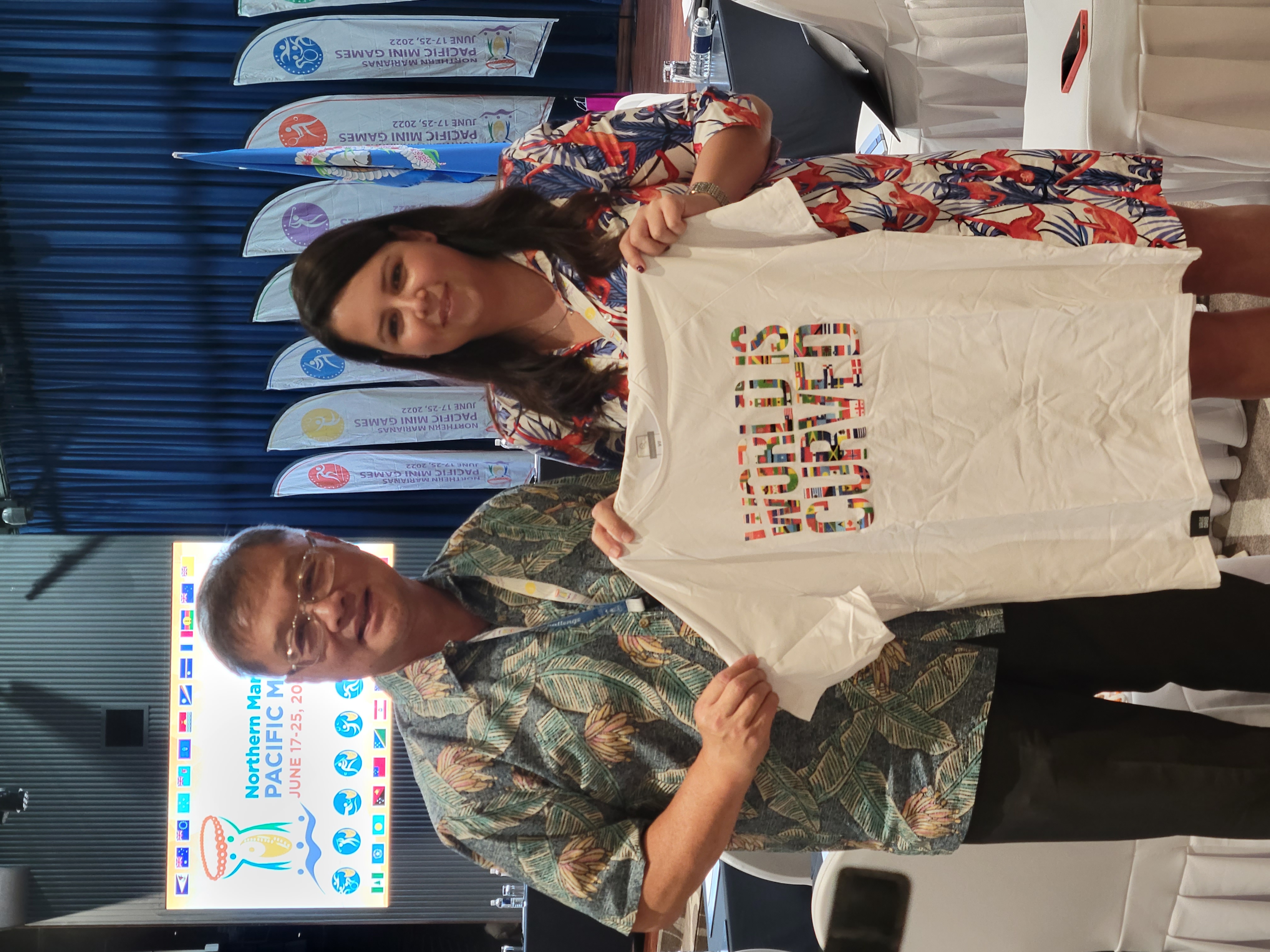 Zita Klinger, continental development manager-Asia & Oceania for the International Federation of Teqball, right, presents a teqball event shirt to Northern Marianas Sports Association President Jerry Tan during her visit on Saipan in June.