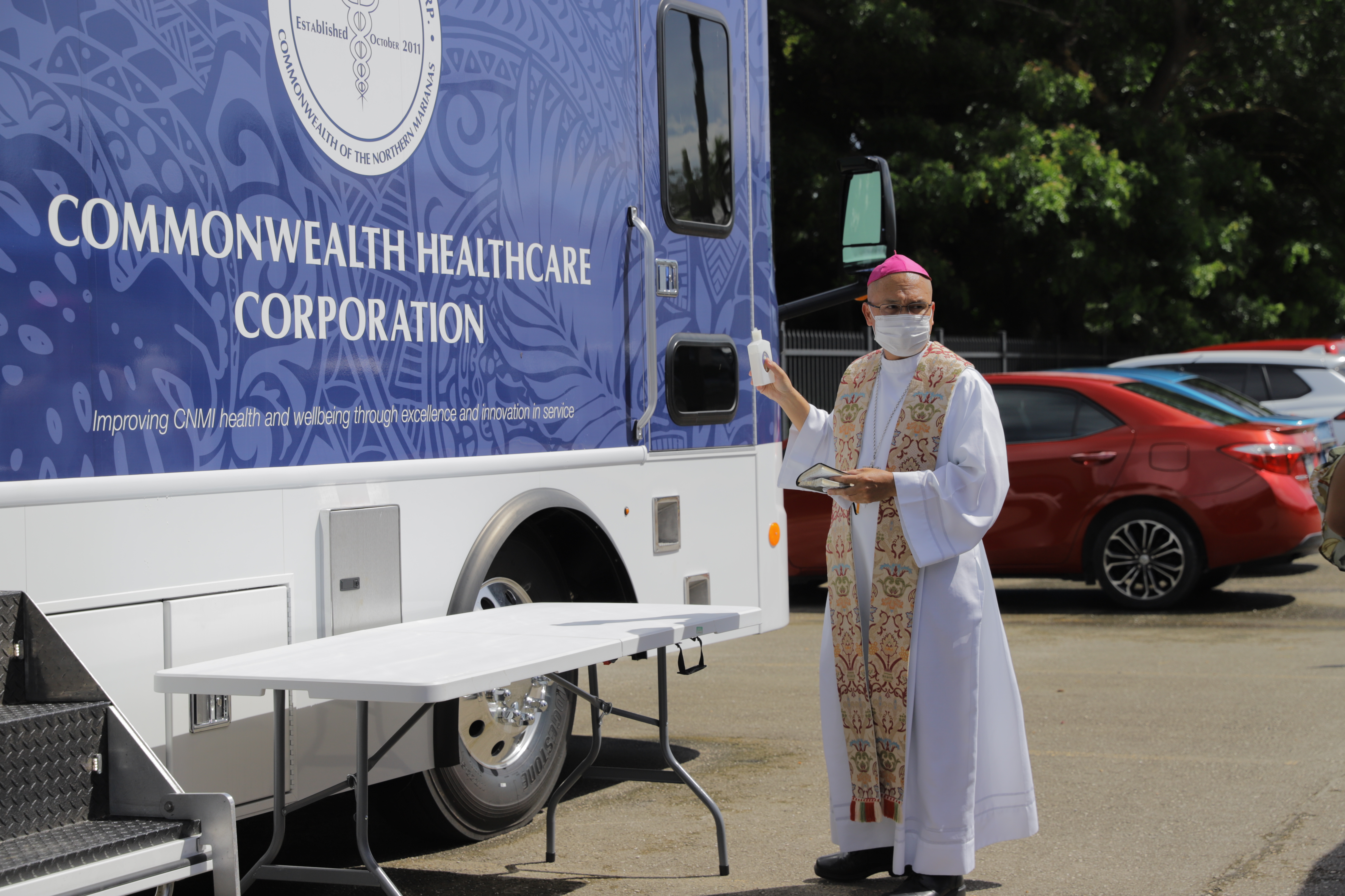 Bishop Ryan Jimenez blesses the new CHCC Mobile Clinic.