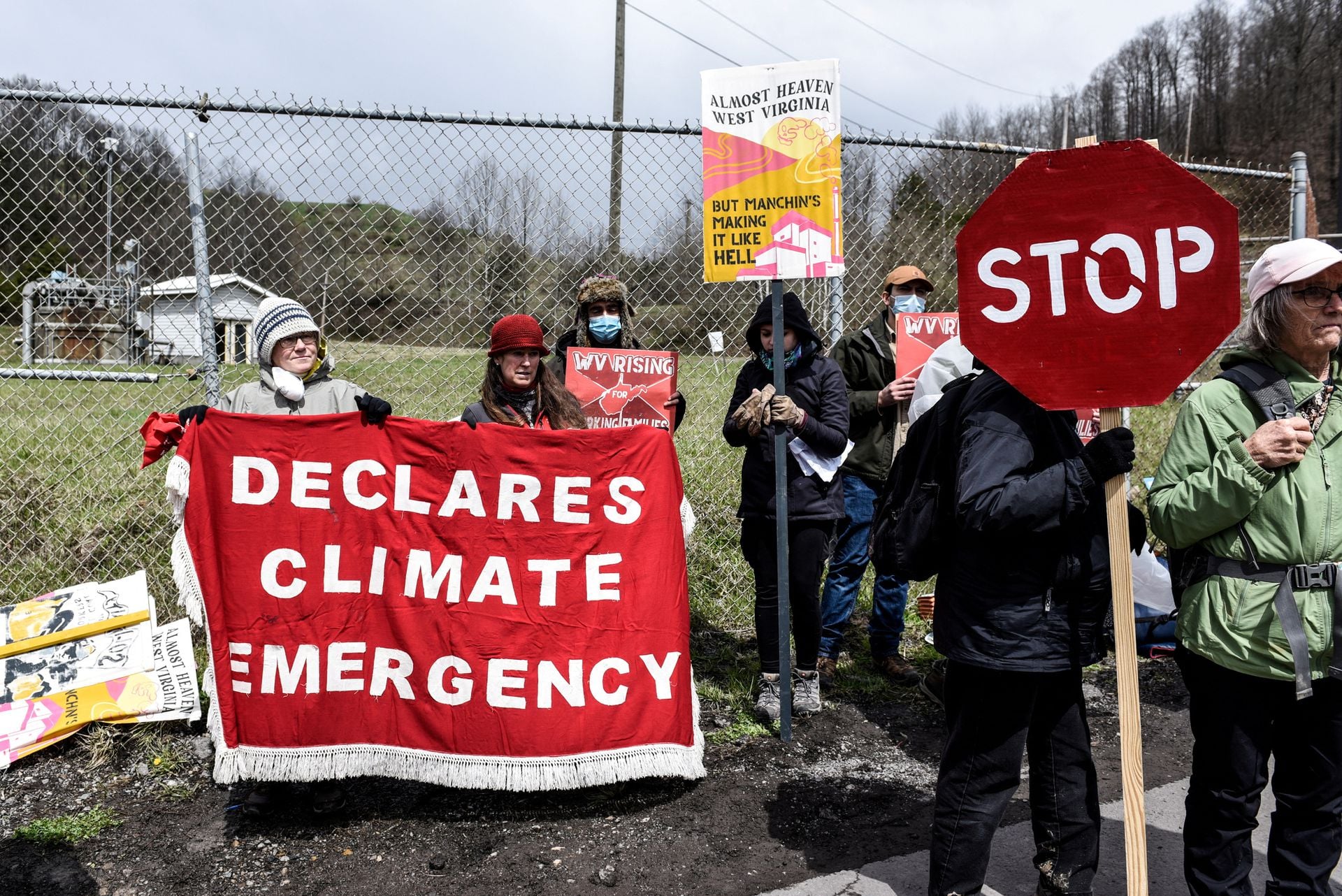 People protest against U.S. Sen. Joe Manchin, D-W.V., as they blockade the Grant Town Coal Waste Power Plant in Grant Town, West Virginia on April 9, 2022.