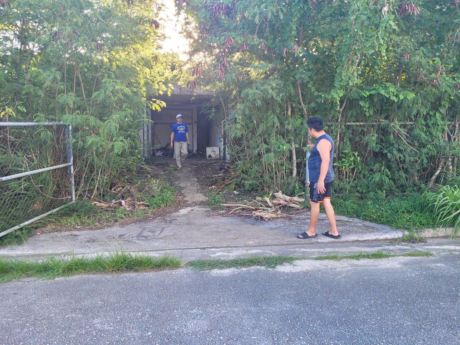 Koblerville residents are seen outside an abandoned house where juveniles “hang out” in the evening.