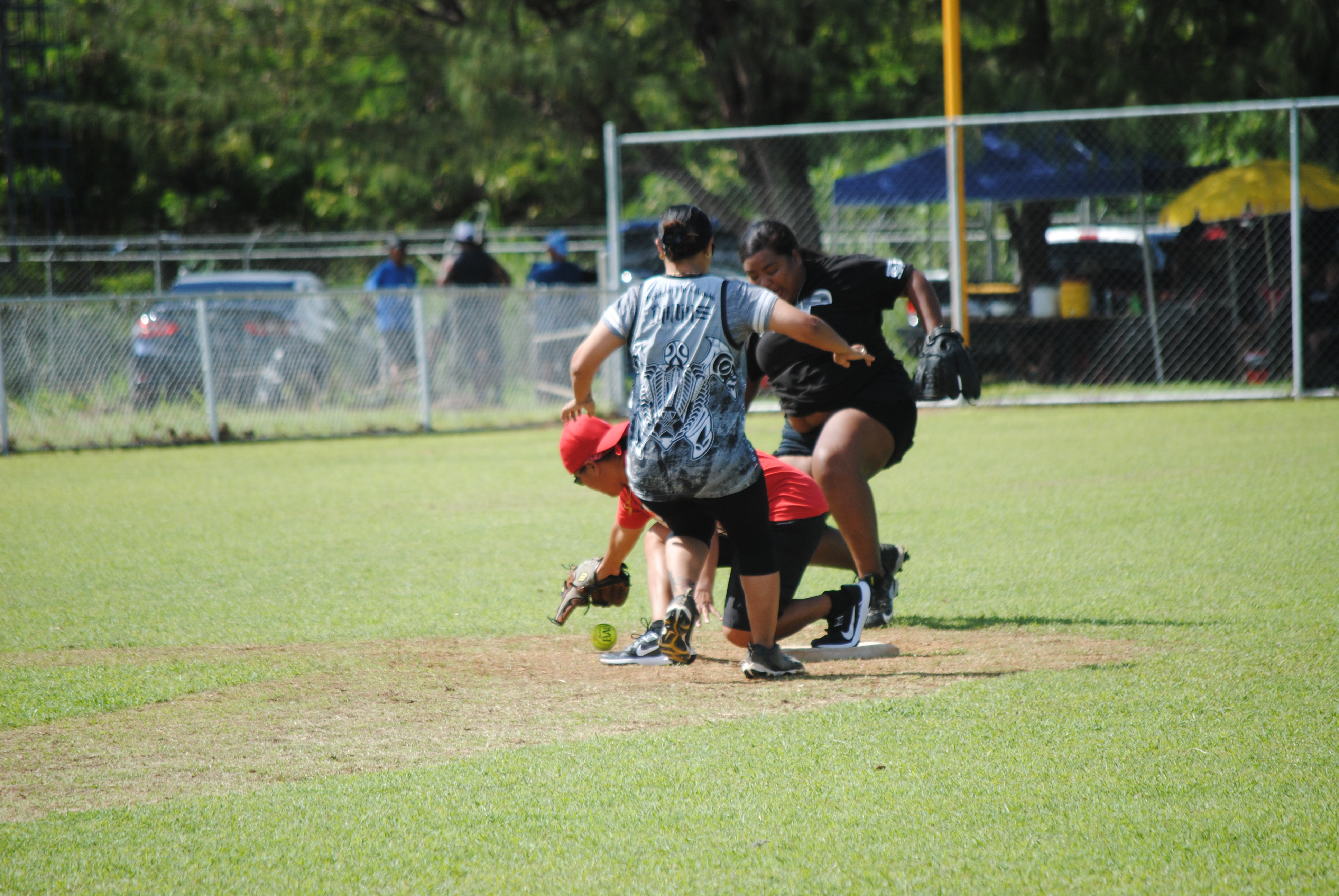 Lady Eagles' Julie reaches for the ball as a runner reaches second base safely.